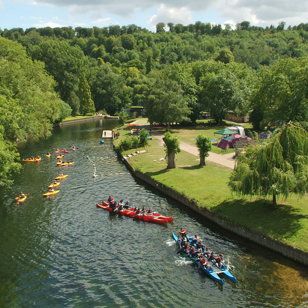 Kayaks and canoes on the river Thames at the Longridge Activity Centre 