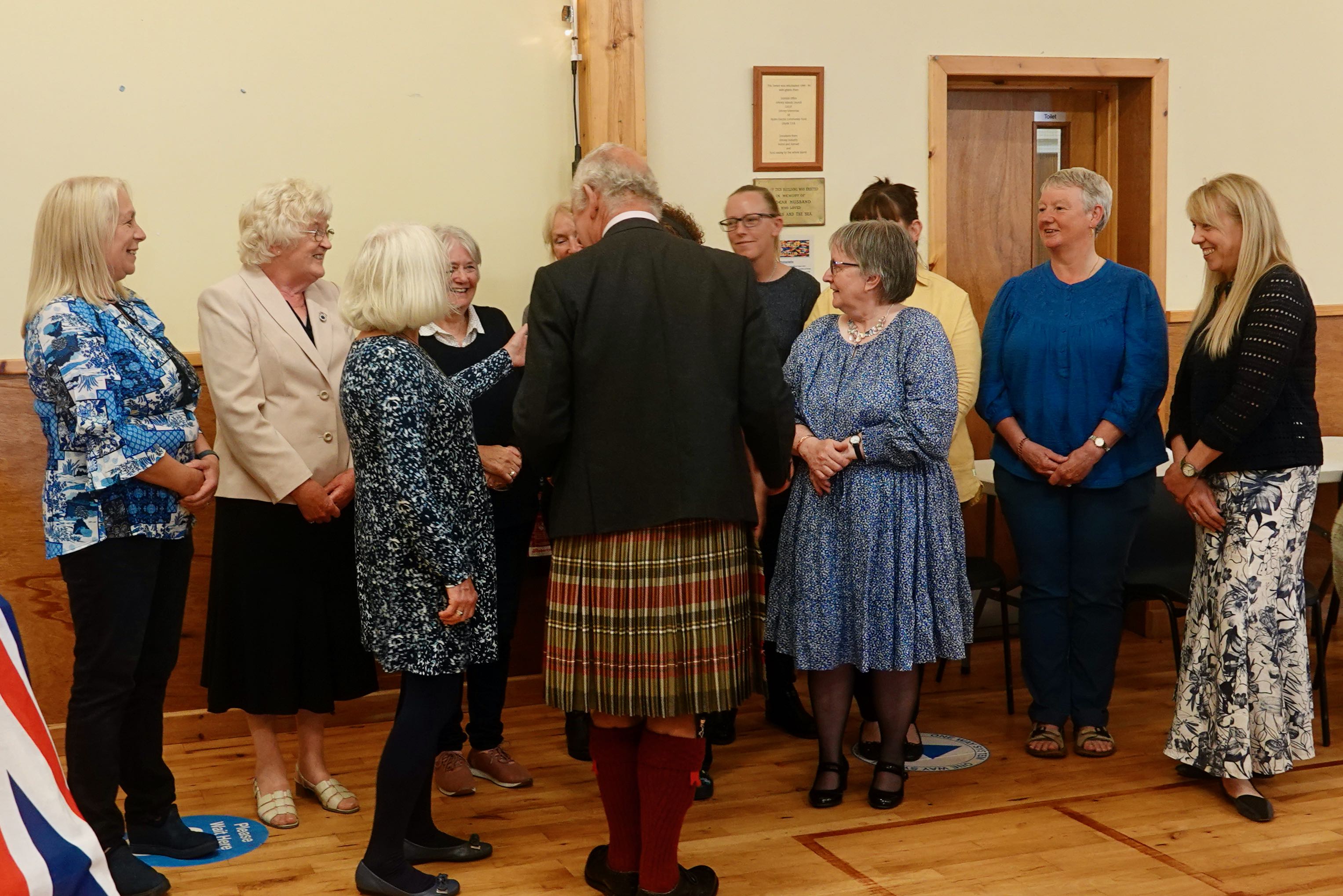 Fundraising volunteers from the Longhope Lifeboat Guild meet HRH The Duke of Rothesay