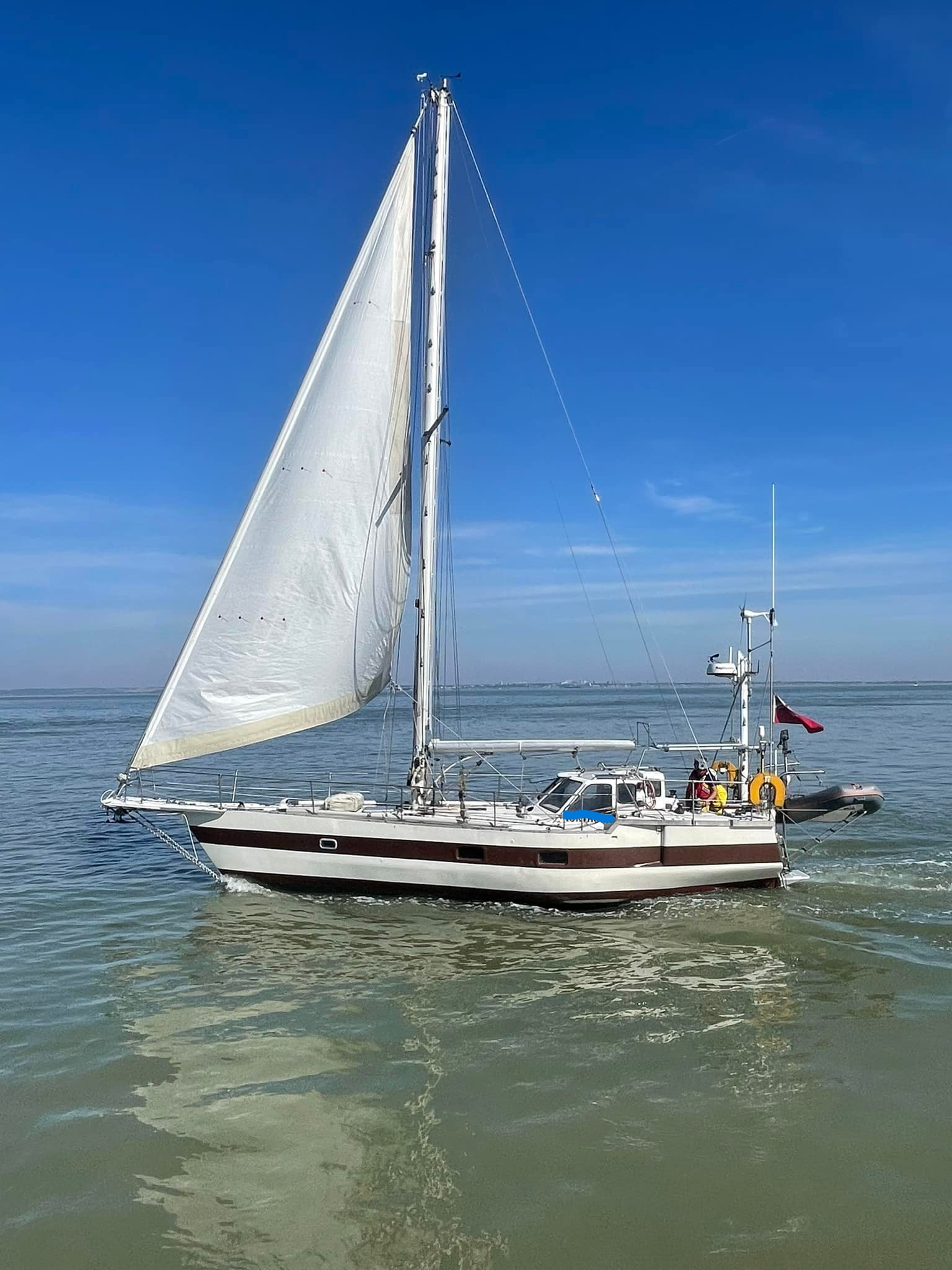 The casualty yacht safely in the hands of expert sailors, crew members Steve and Jack