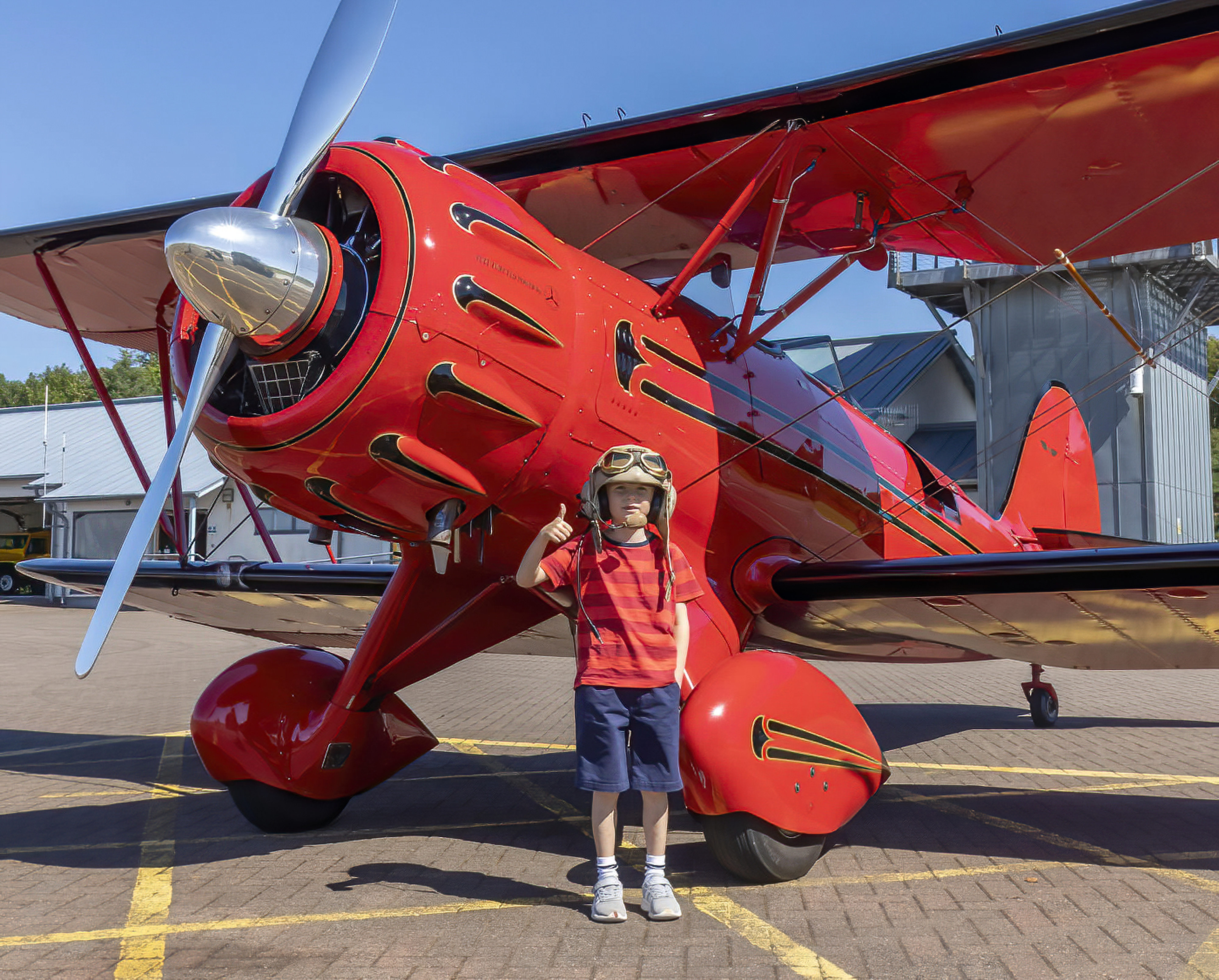Seven year old Finlay MacInnes in front of the WACO biplane