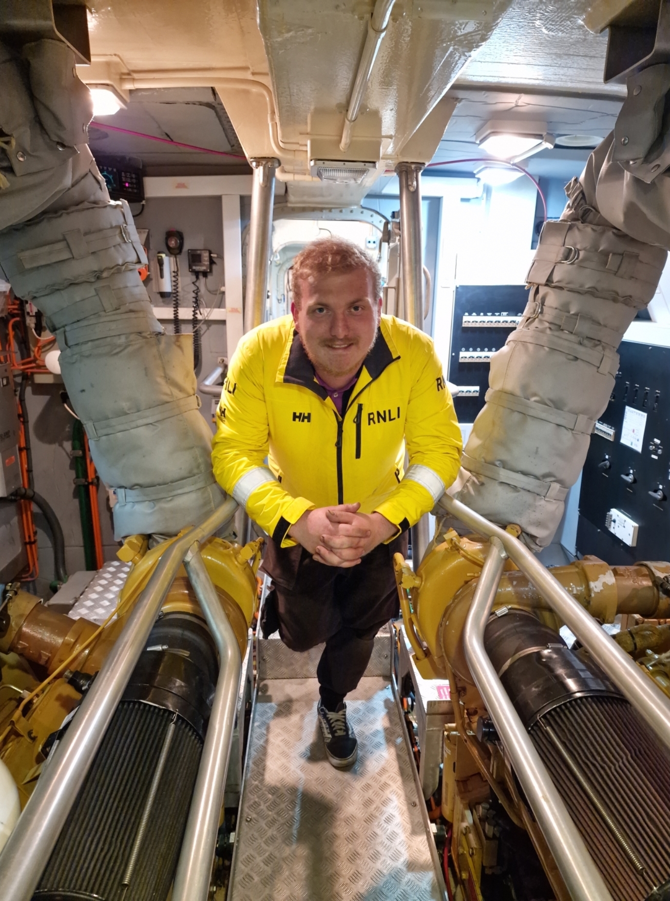 Greg McMurchy, standing in the engine room