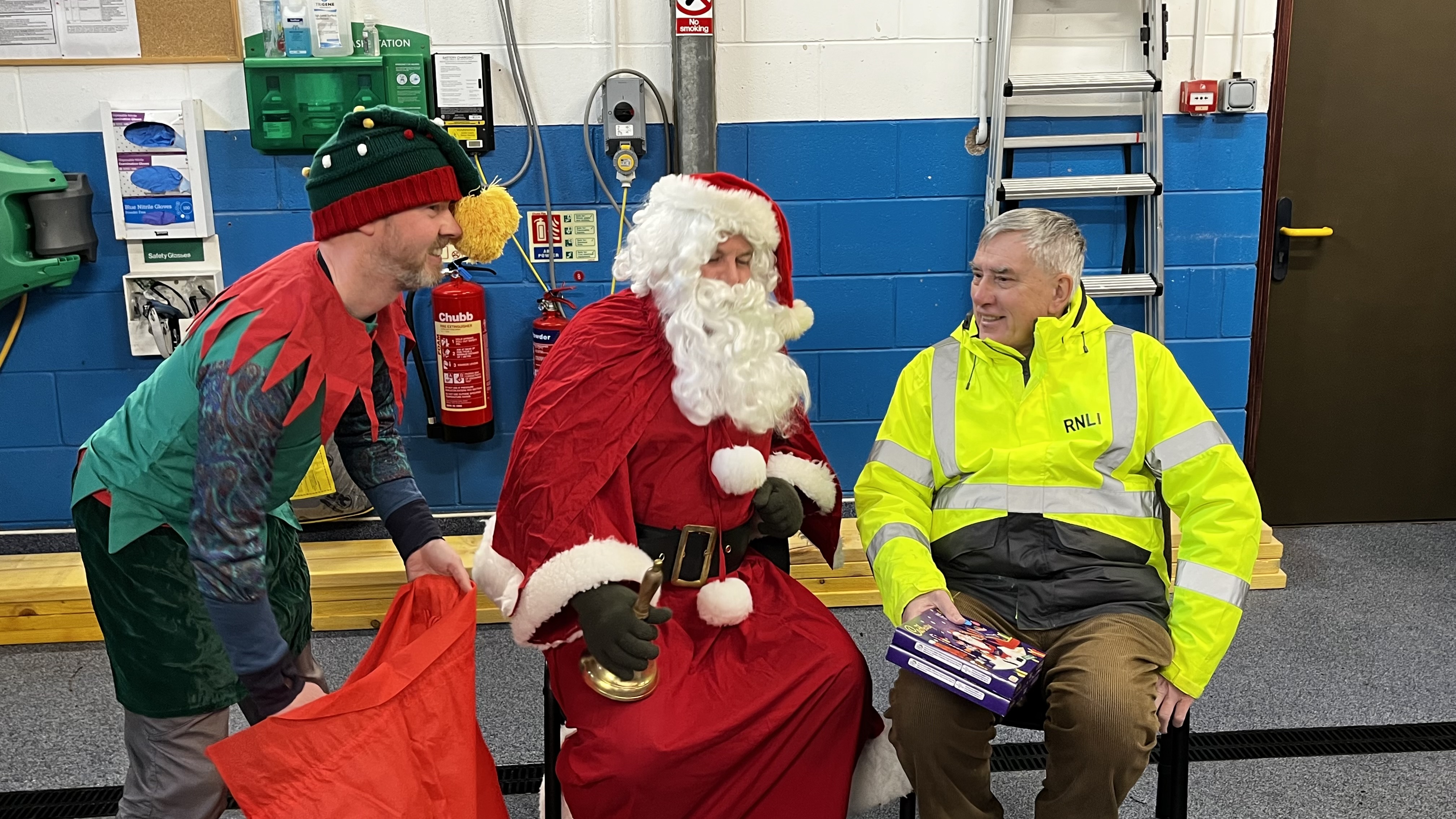 Santa and his Elf with Lifeboat Operations Manager John Griffiths
