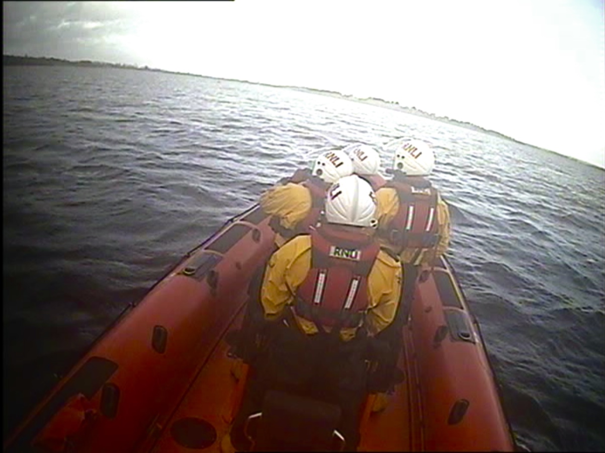 Crew on board the lifeboat, looking over the port side
