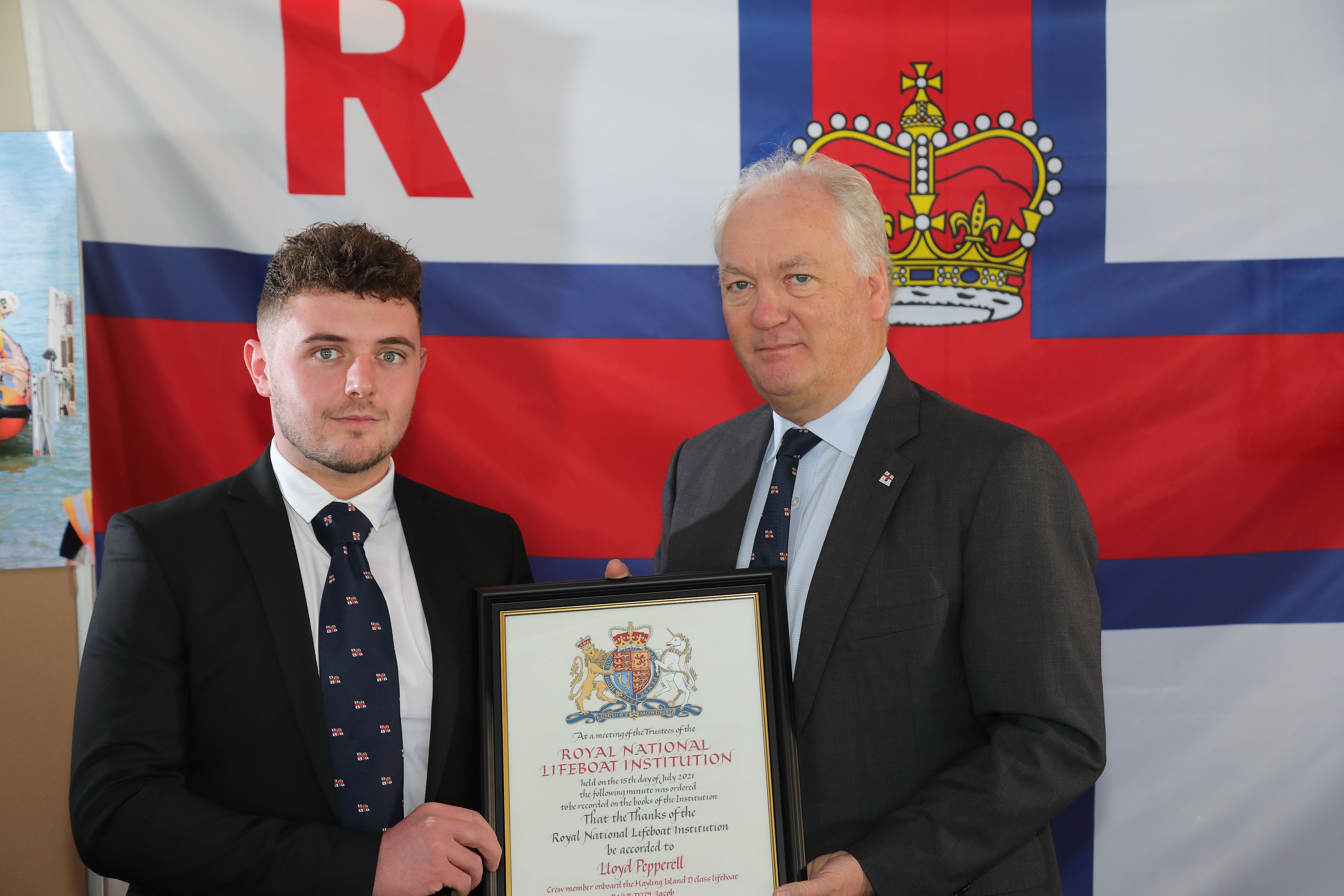 Volunteer crew member Lloyd Pepperell with Mark Dowie, Chief Executive of the RNLI.