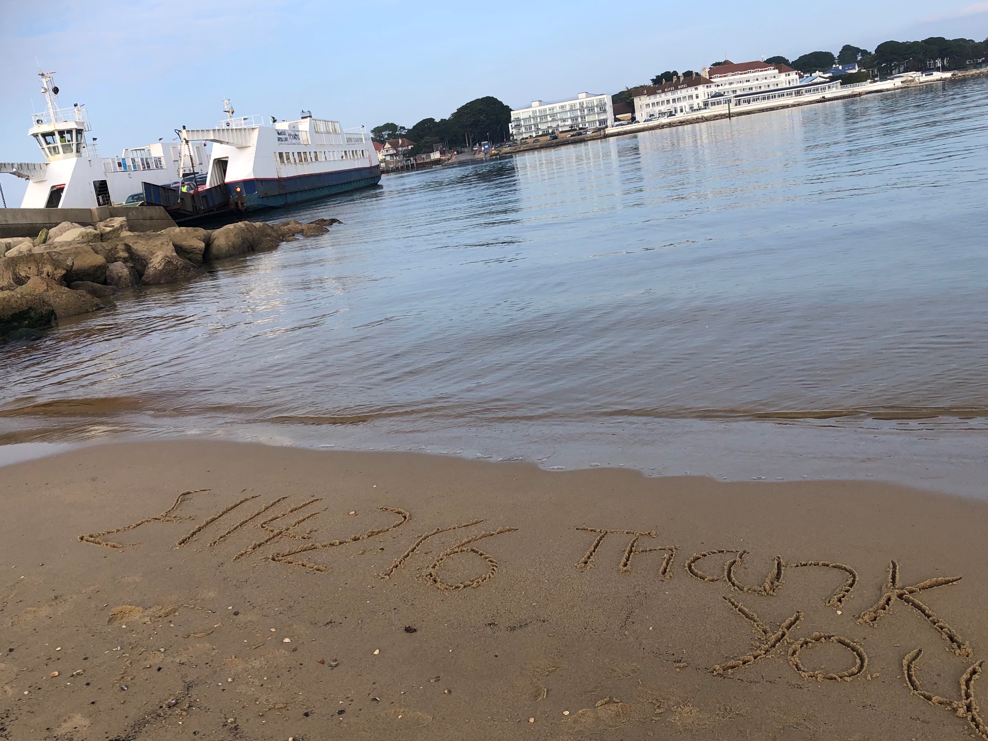Message in the sand, with Ferry in the background