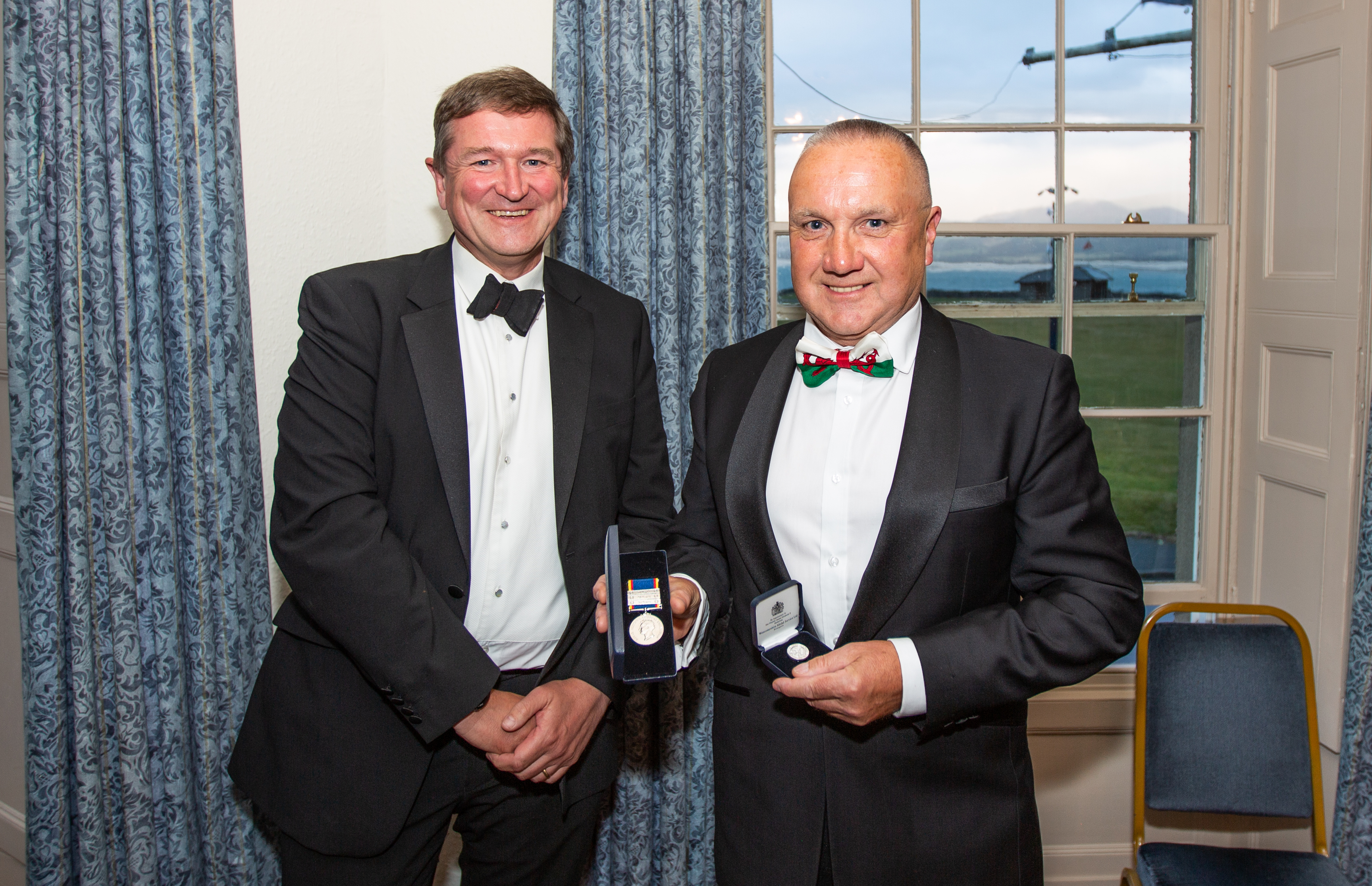 Stuart Wallace presenting Gareth with his 50 years of voluntary service award
