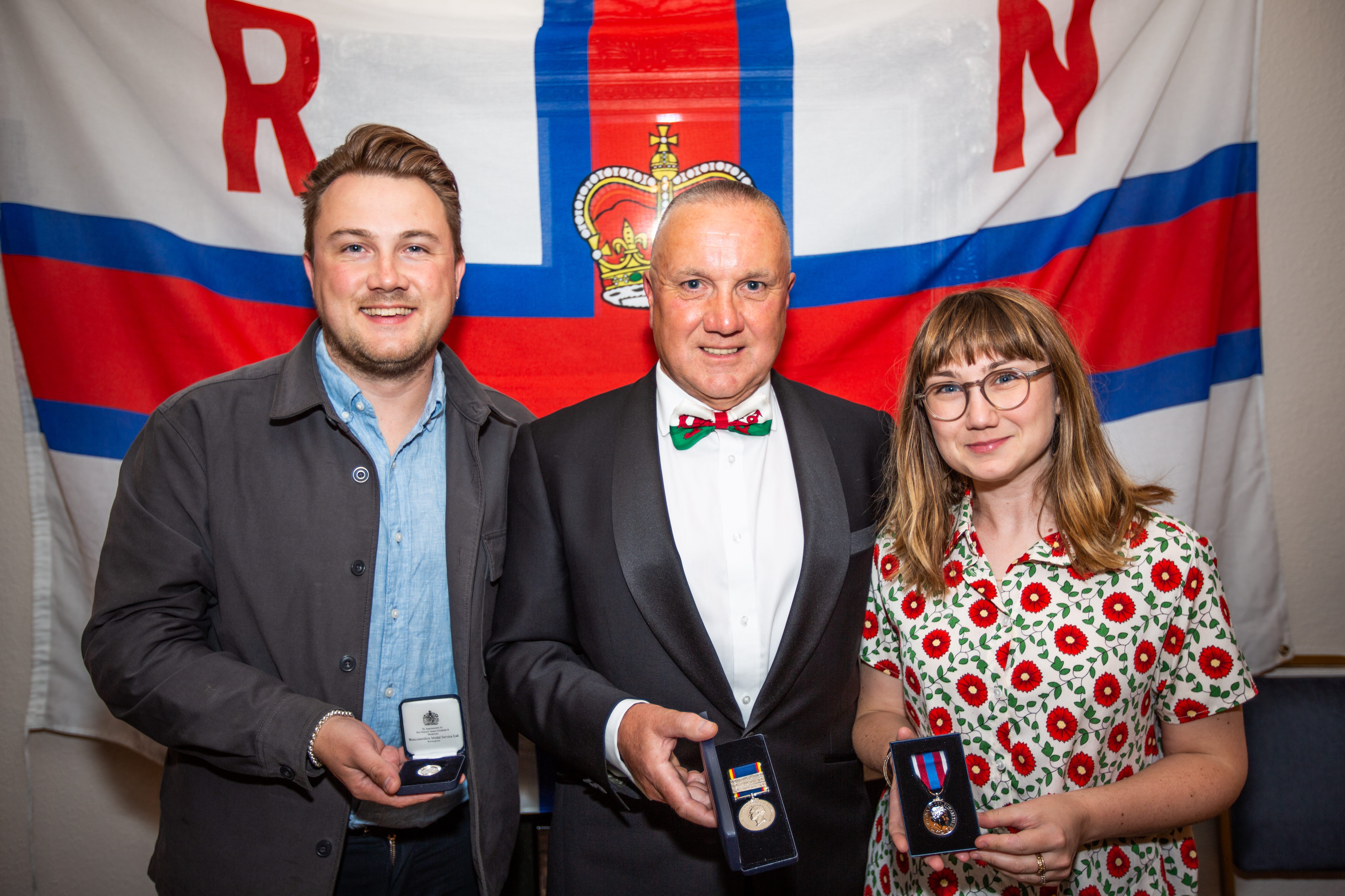 Gareth with his son and daughter with his awards including the Queens Platinum Jubilee Medal