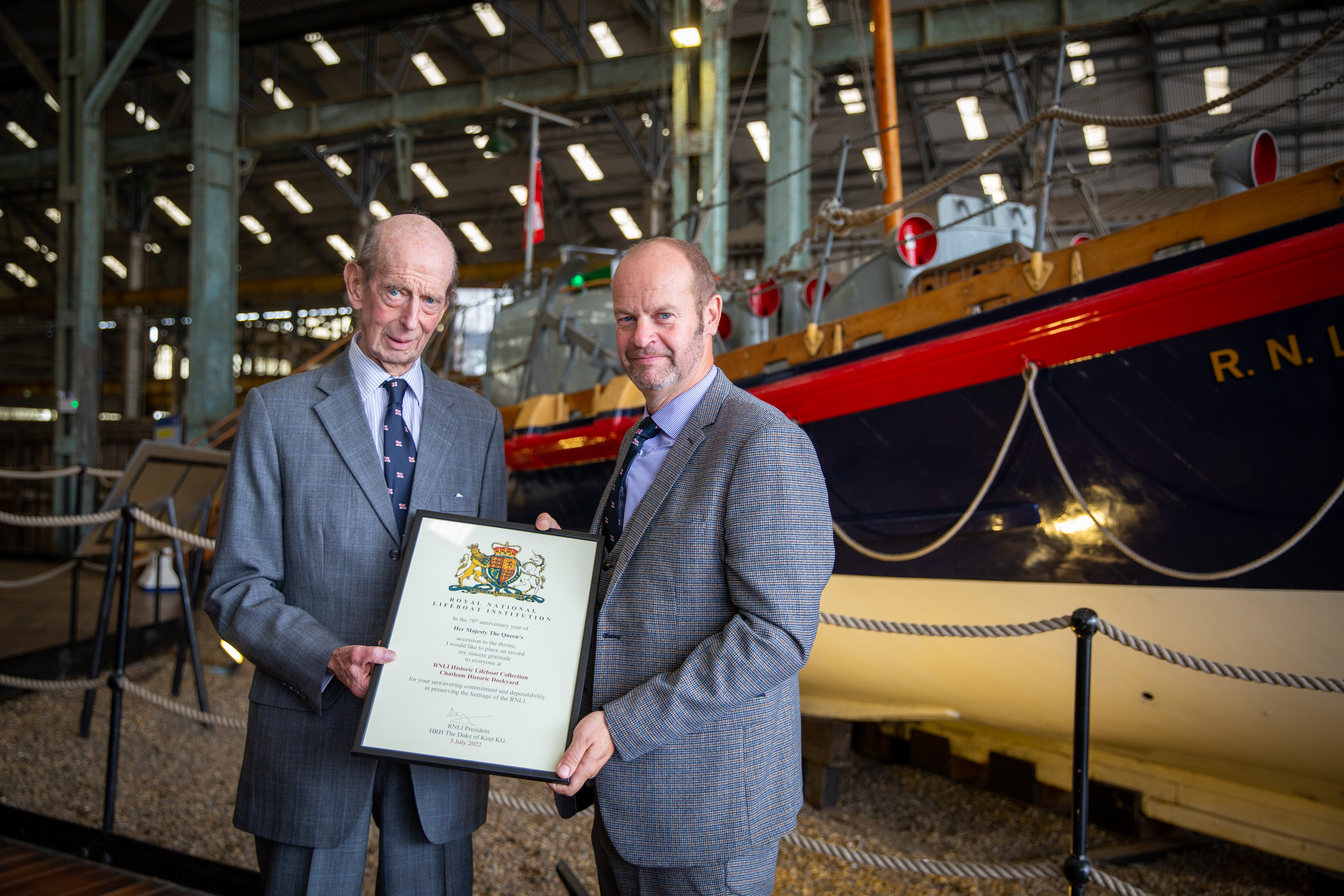 HRH presenting Volunteer Gallery Manager and Gravesend Lifeboat Station Thames Commander and Acting Station Manager, Ian Smith, a signed certificate to commemorate his visit during The Queen’s Platinum Jubilee Year
