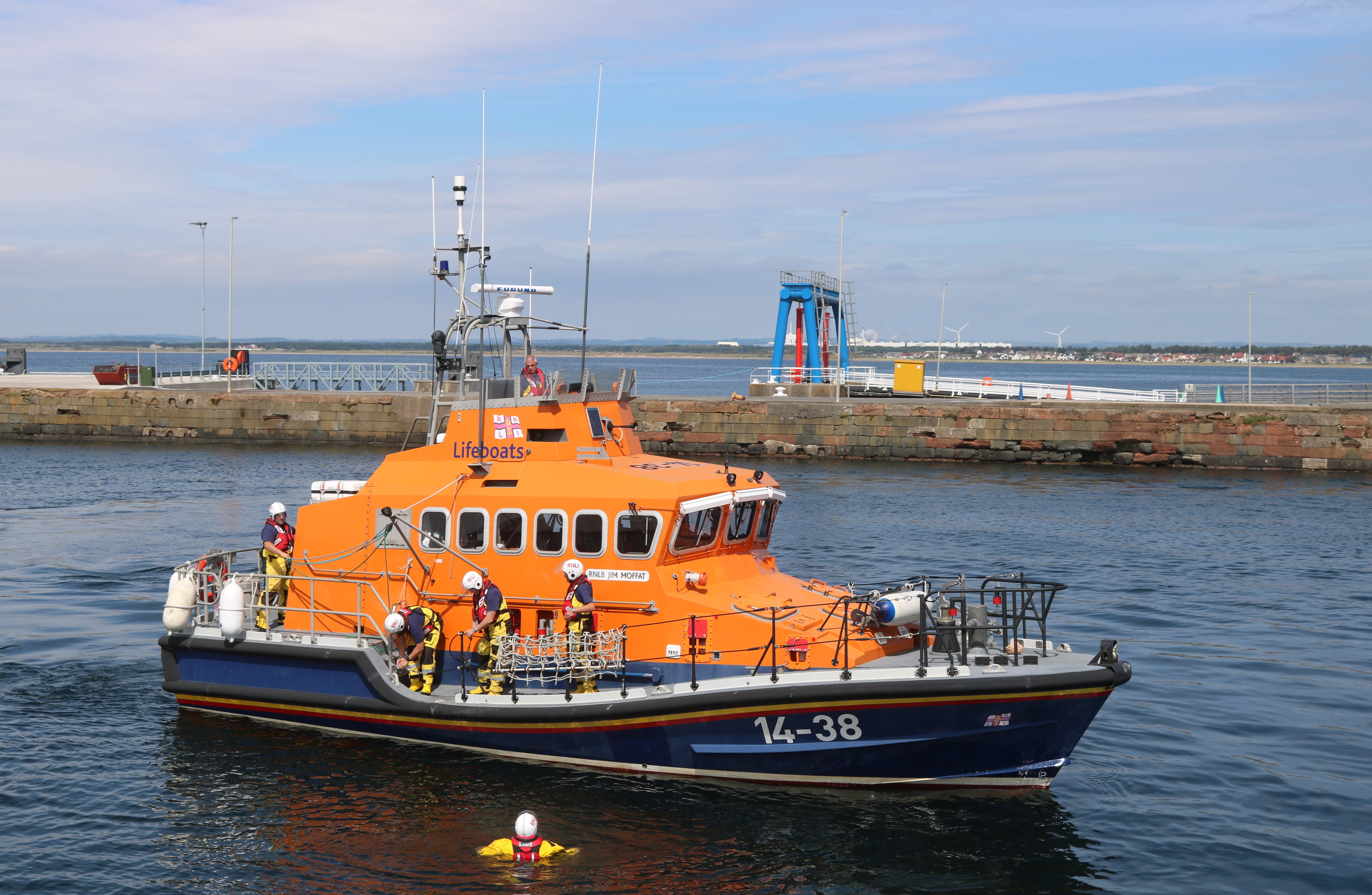 Troon RNLI all-weather lifeboat carrying out a man overboard drill off the lifeboat pontoon