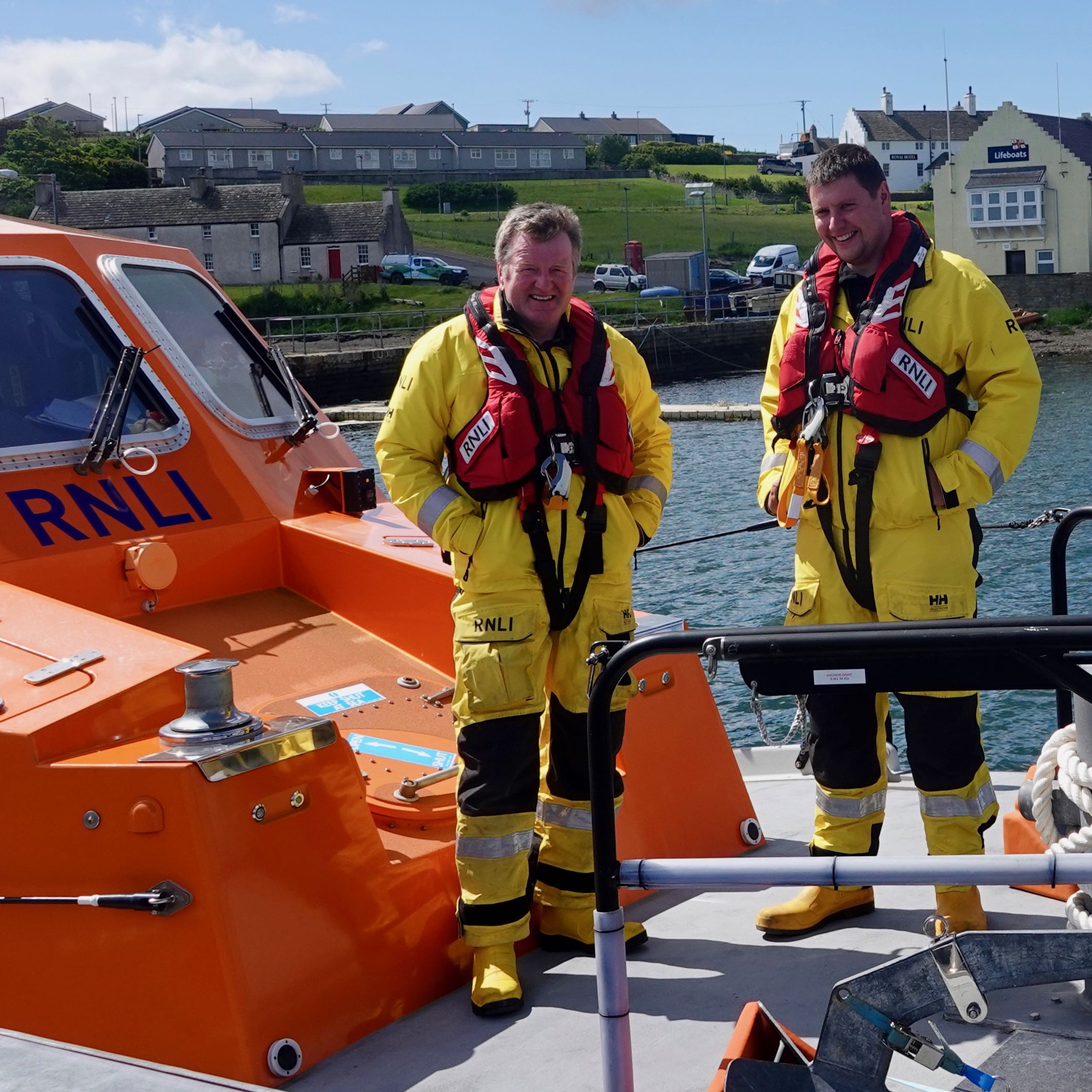 Former coxswain Kevin Kirkpatrick and new coxswain Scott Johnston onboard RNLB Helen Comrie at Longhope Pier