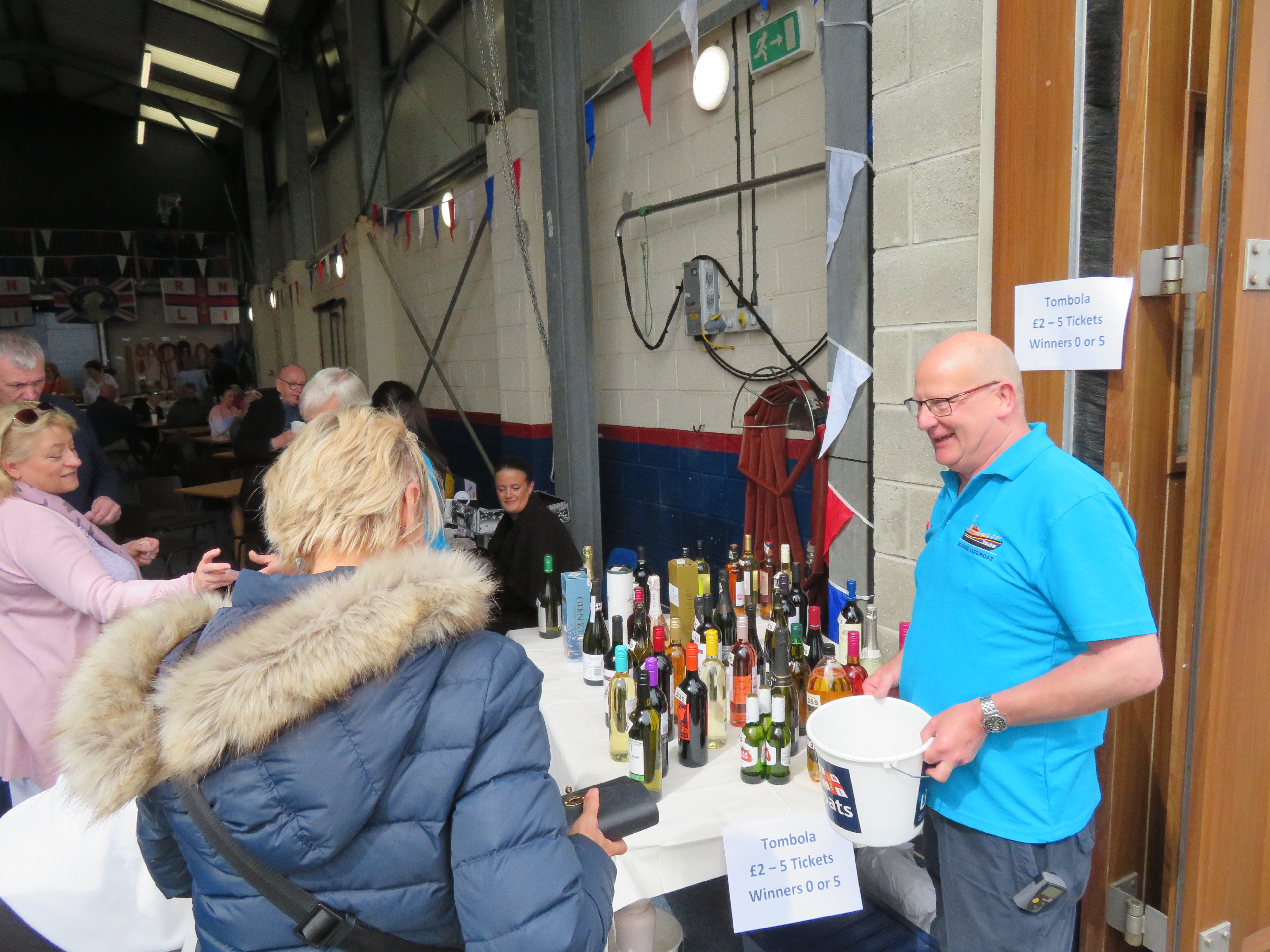 Crew Member Neil McLean eagerly selling Tombola tickets.