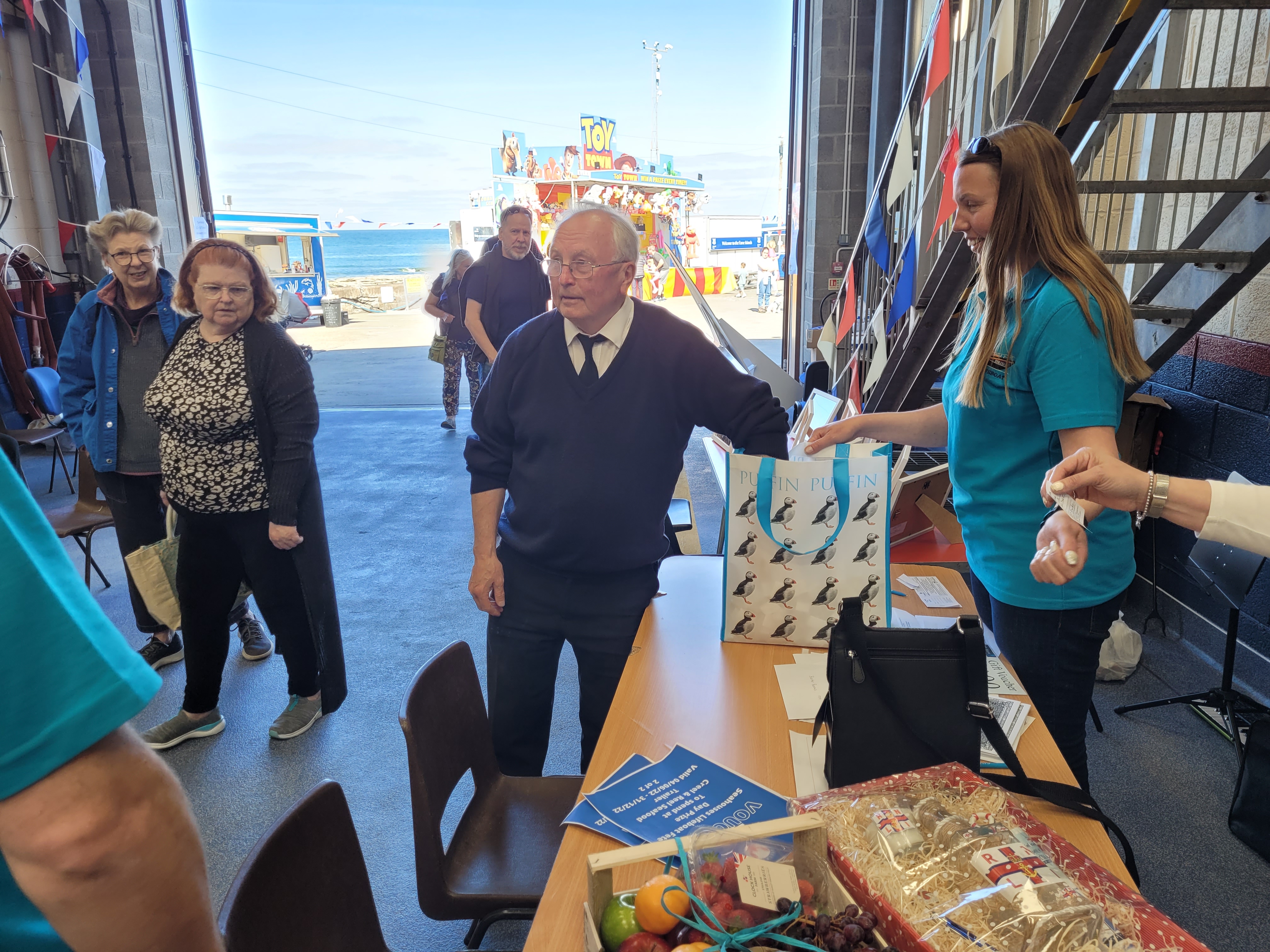 Seahouses Harbour Master draws the winning raffle tickets !