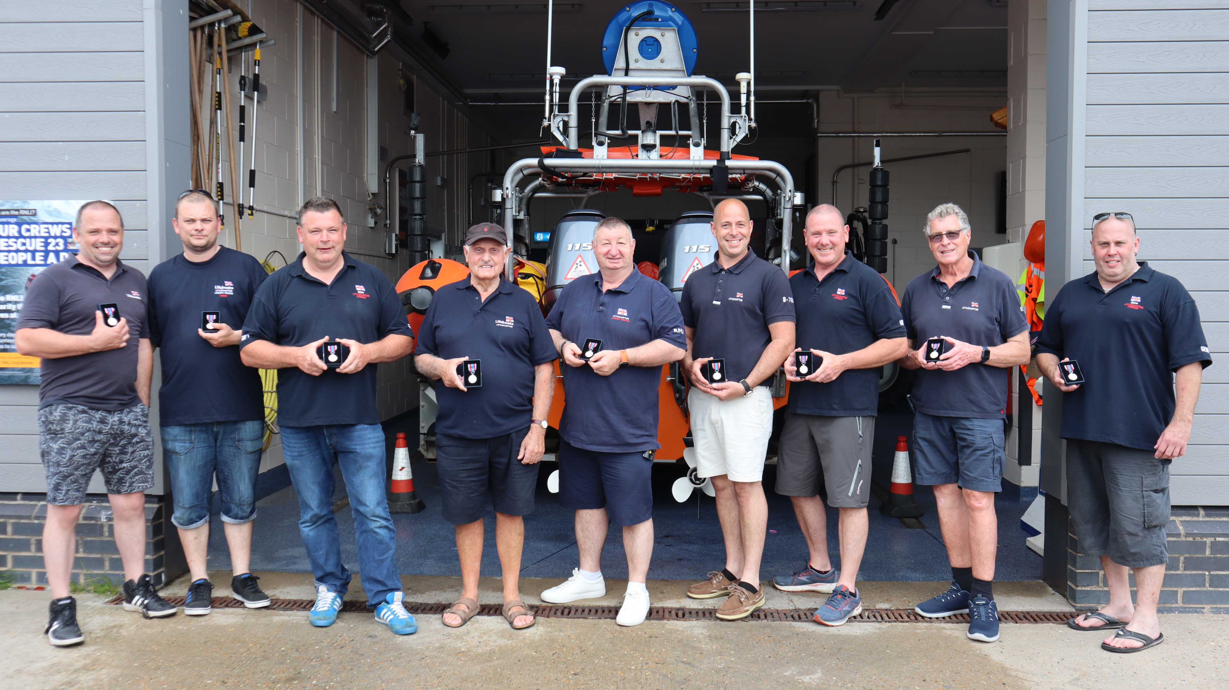 Nine Littlehampton RNLI volunteers receive their Platinum Jubilee medal 