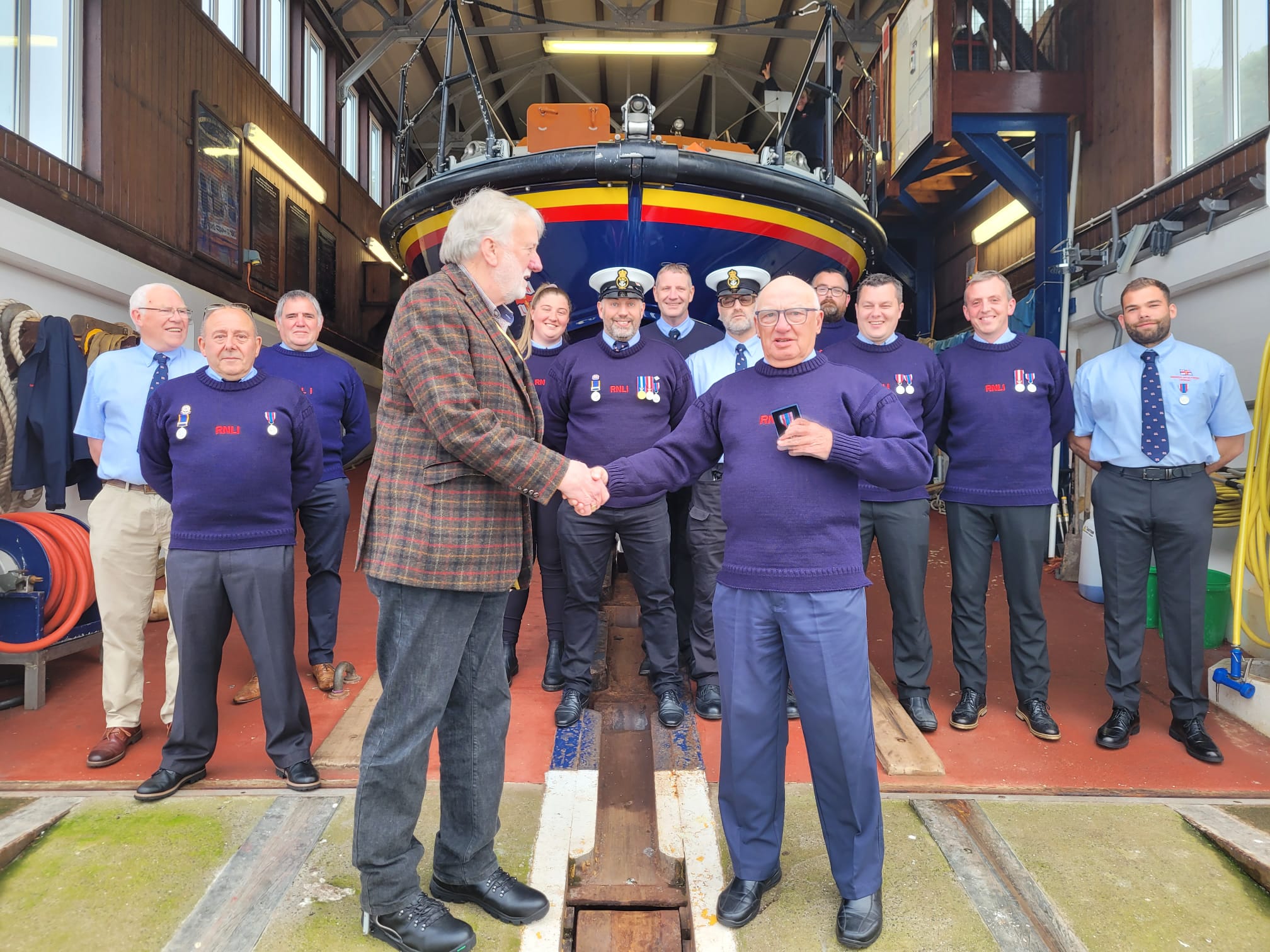 Town Mayor Councillor Mike Greener, presents Crew with Platinum Jubilee medals