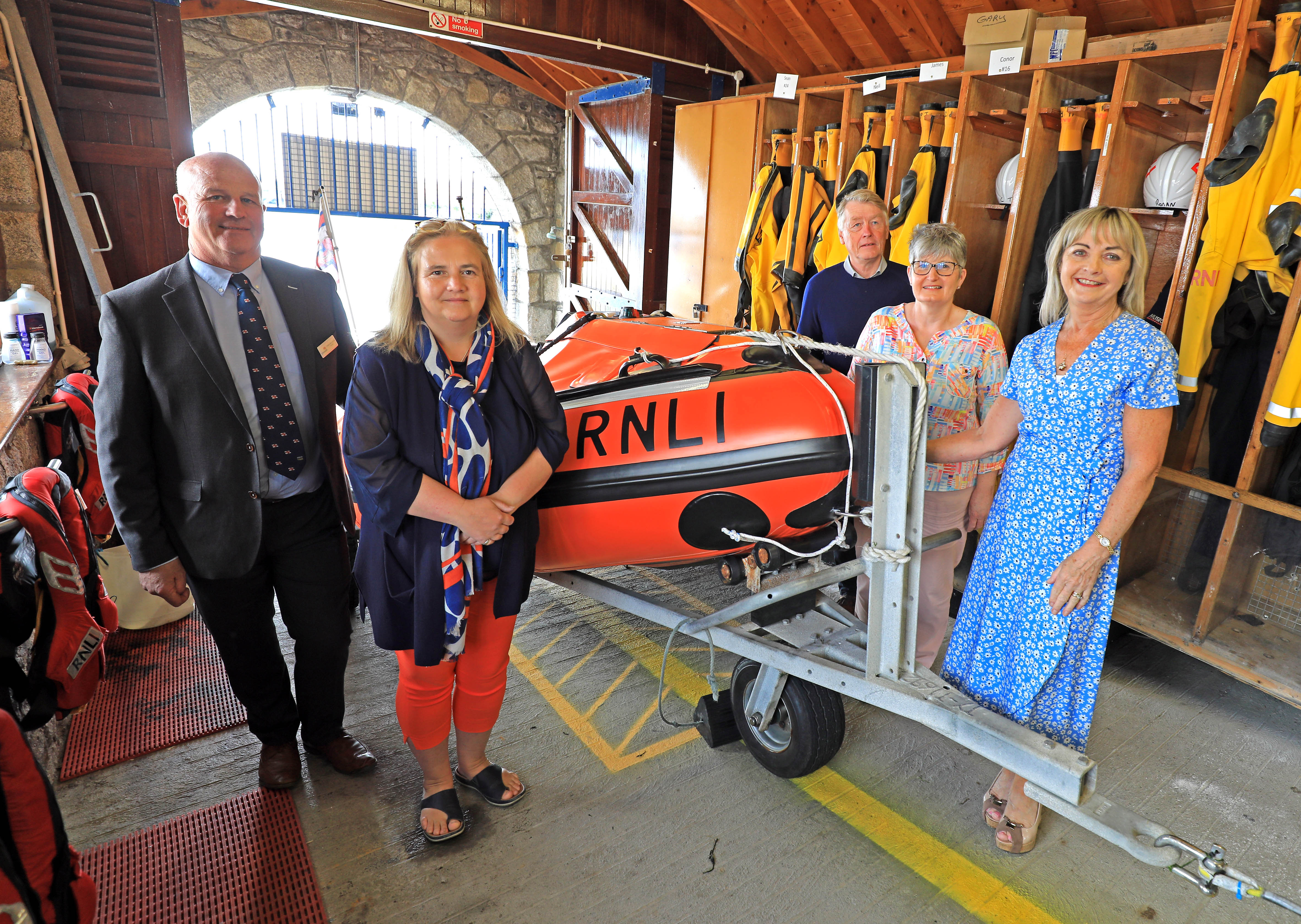 Visiting the new lifeboat ‘Joval’ at the inshore boathouse before the ceremony, Trustee and Irish Council Member Paddy McLaughlin with friends and neighbours of the late Mr and Mrs Staunton; Amber Craughwell, Manus Hingerty, Maria McGarry Curley and Jacqueline Duffy