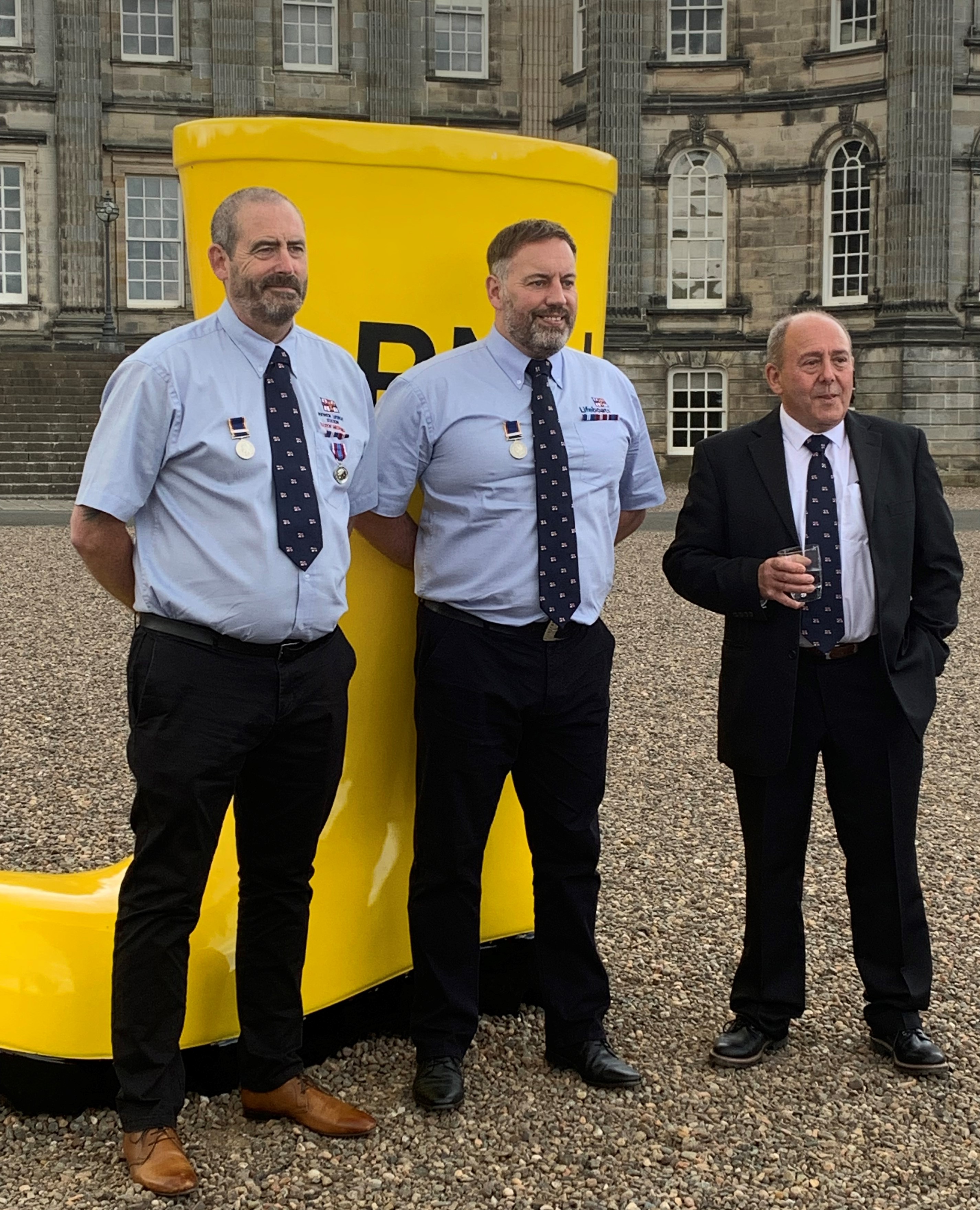 Left Mechanic Phil Paterson, Second Coxswain Robert Frost and Lifeboat Operation Manager Brian Cowan who have all served over 30 years each as volunteers for the RNLI