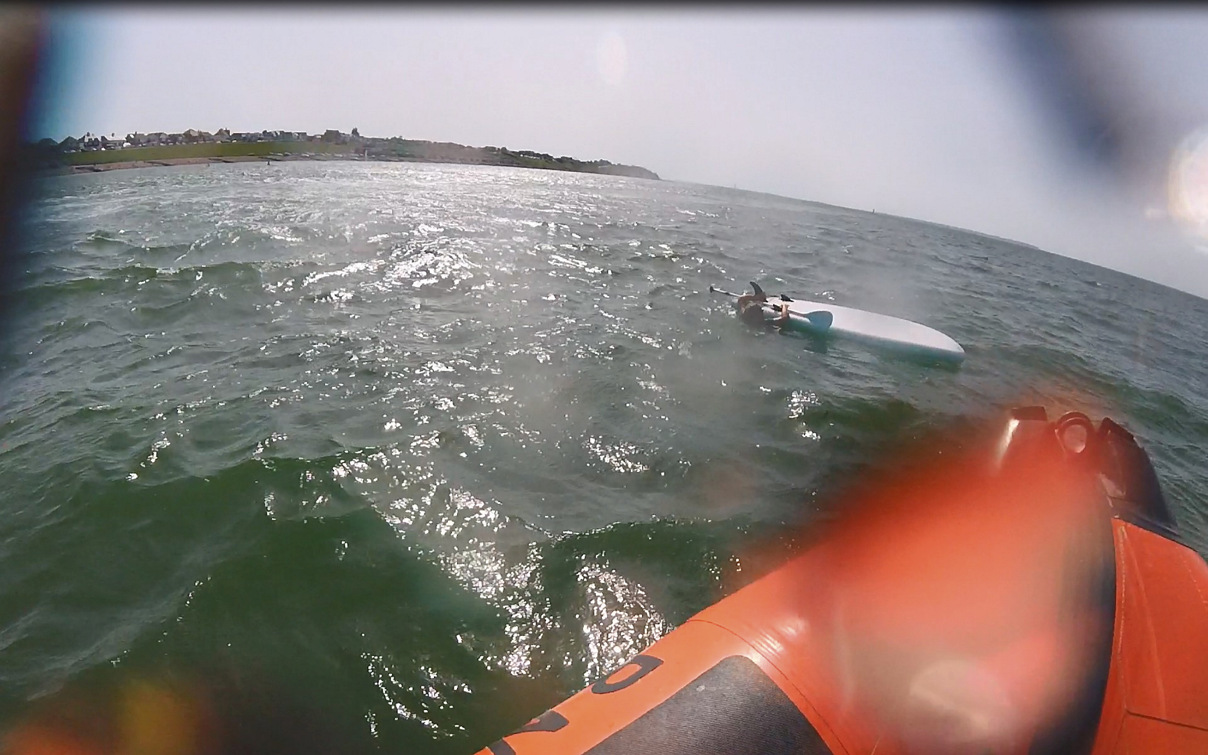 Whitstable lifeboat comes alongside the paddleboarder in need of assistance off Tankerton on Friday afternoon.