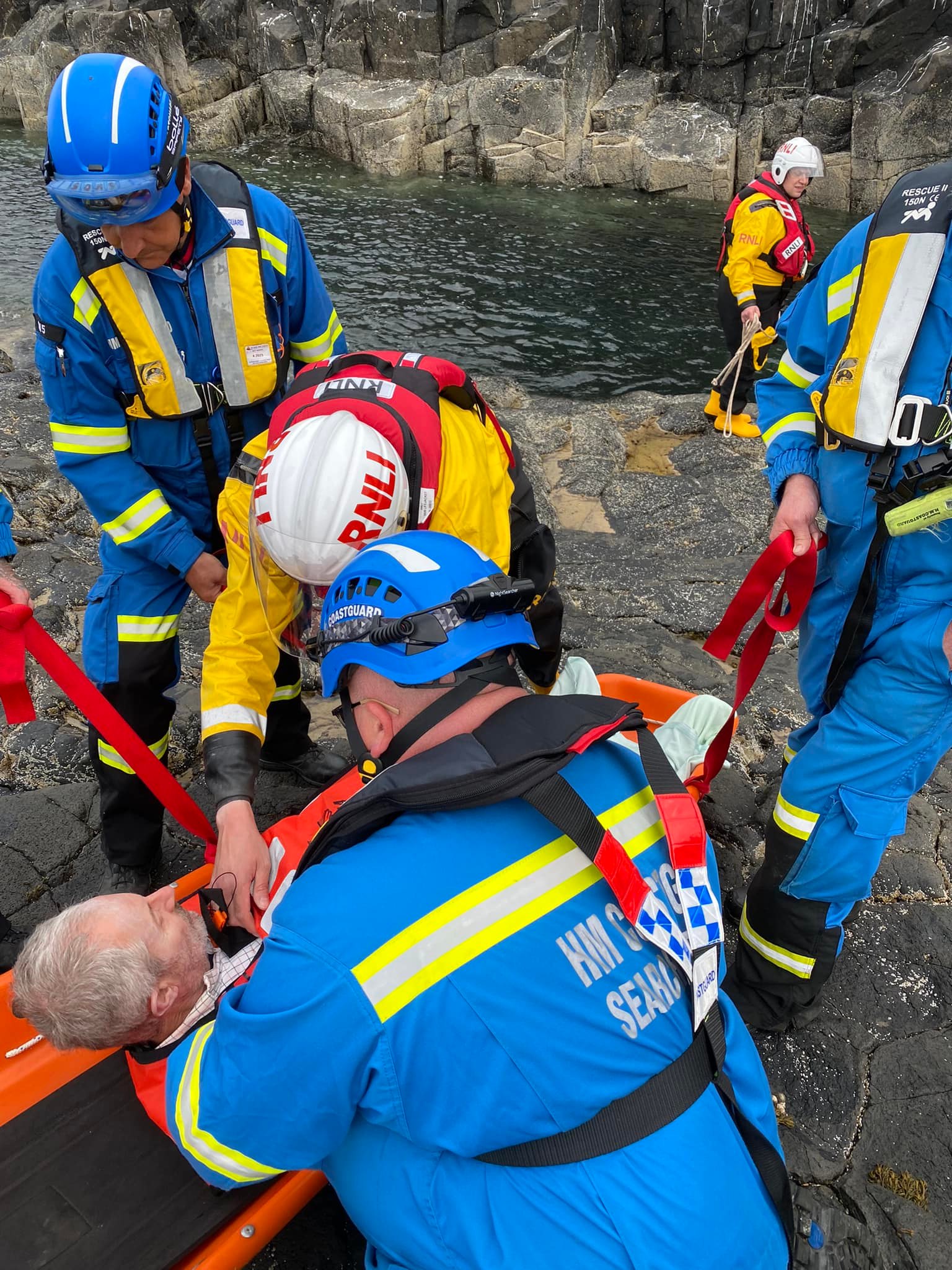 Casualty being assessed by RNLI crew and Coastguards