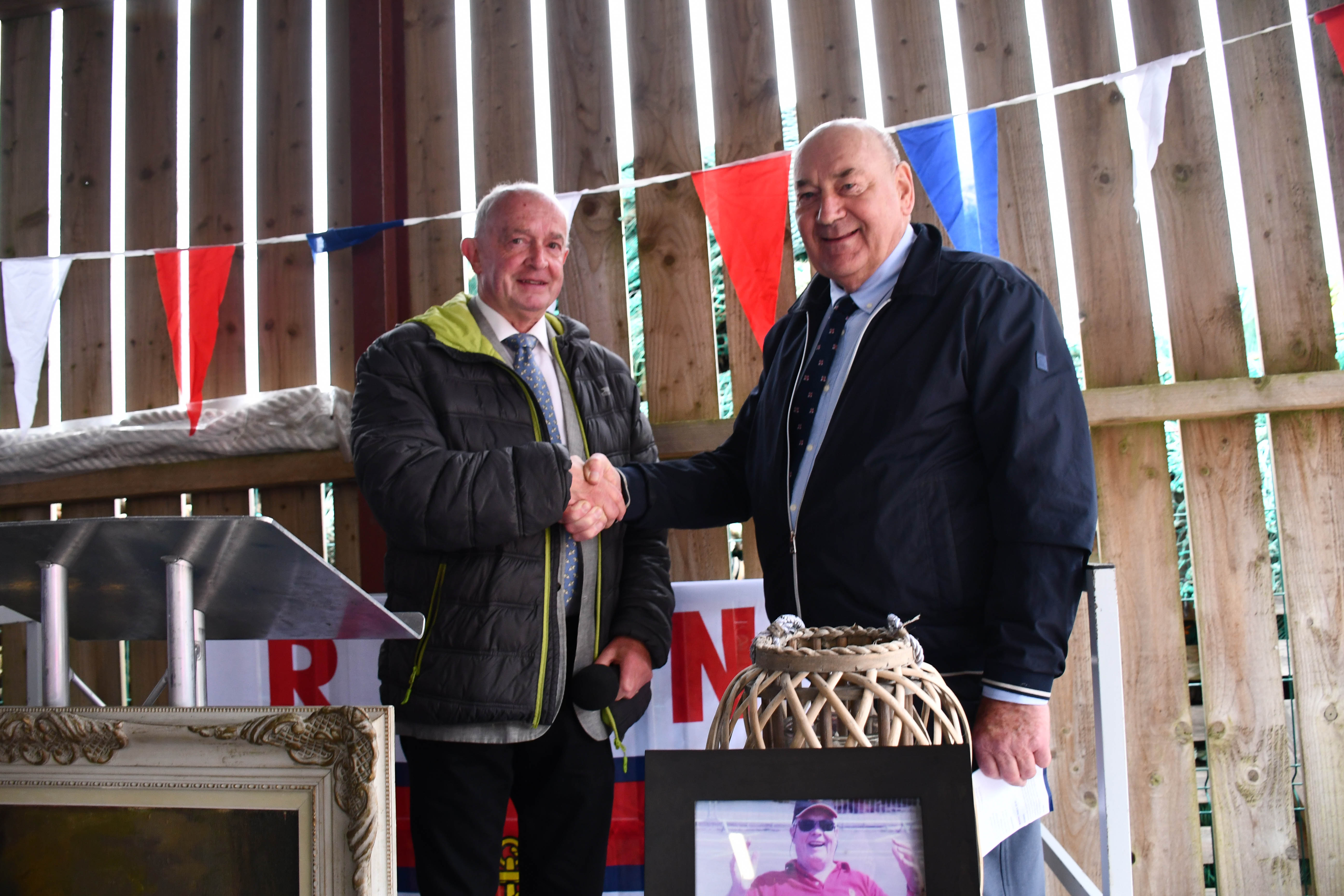 Eddie Fitzgerald hands the lifeboat into the care of the RNLI represented by John Killeen