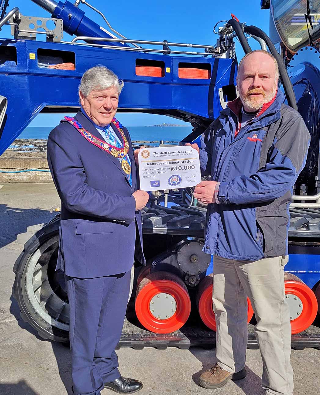 Mark Loughlin accepting the donation