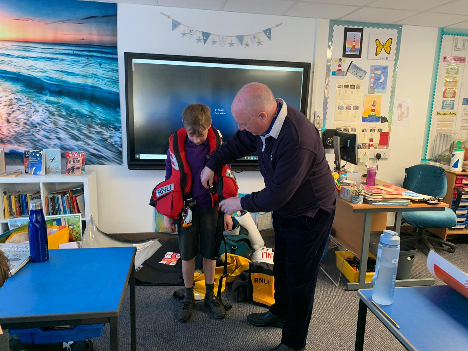 A future lifesaver trying on a lifejacket