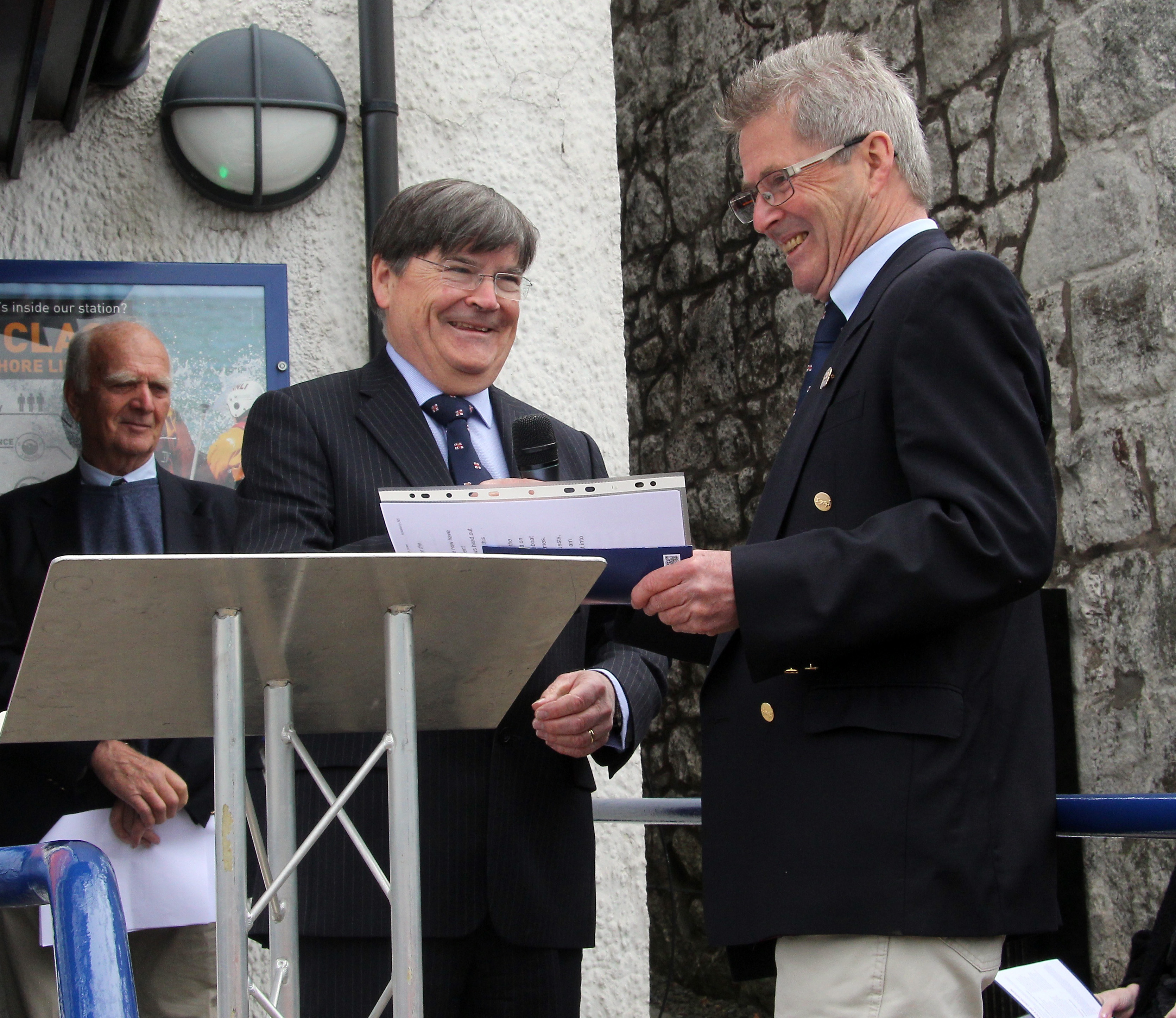 Gareth Jones accepts the lifeboat from Roger Lockwood