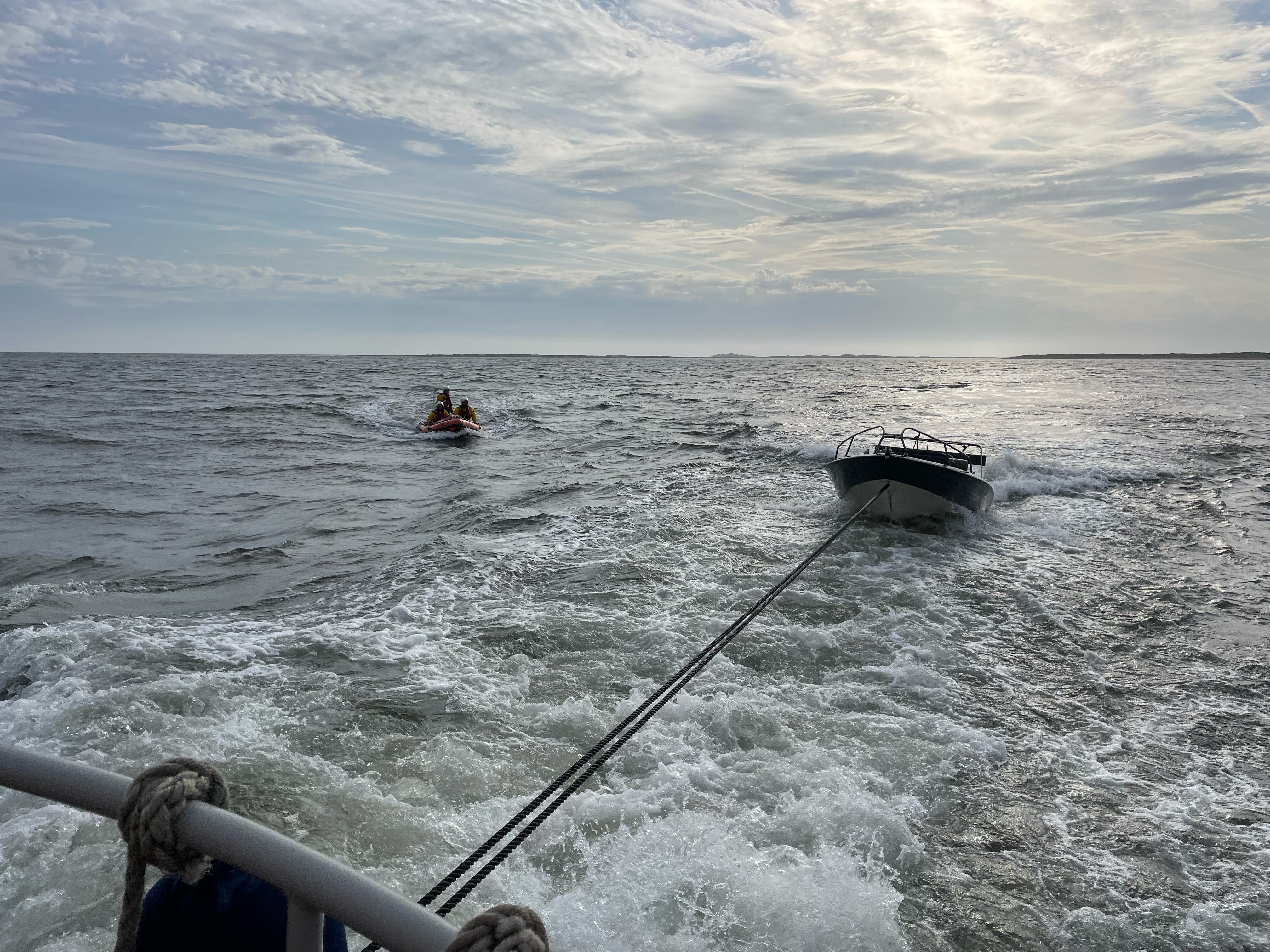 Speedboat being towed through the sea