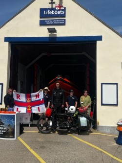 Harry (centre) with form left Tim Bailey Lifeboat Operations Manager Beaumaris , Harry and Mathew form the face to face fundraising team and Angharad a shop volunteer