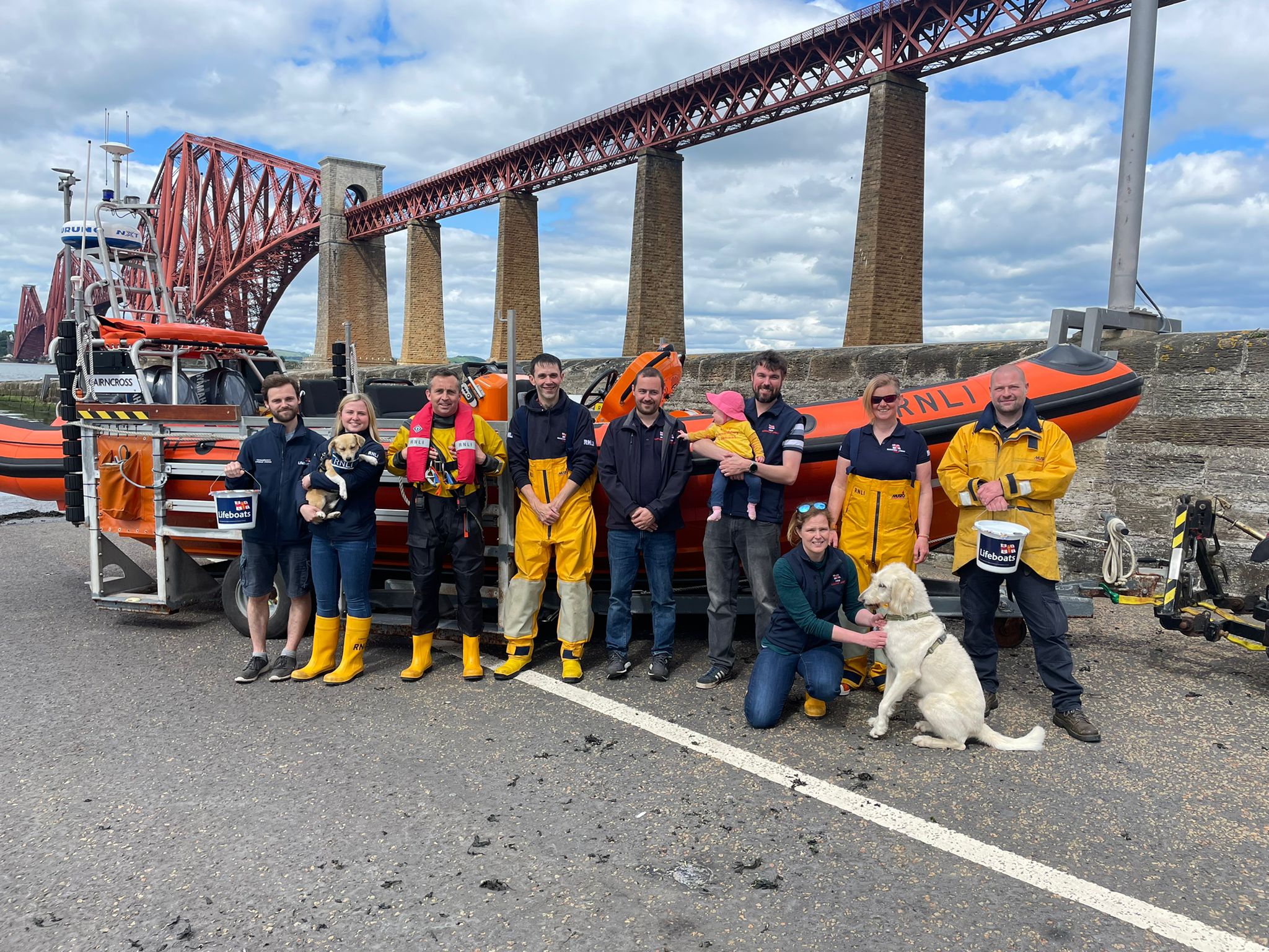 Queensferry RNLI volunteer crew members beside Atlantic 85 Lifeboat Jimmie Cairncross before the walk