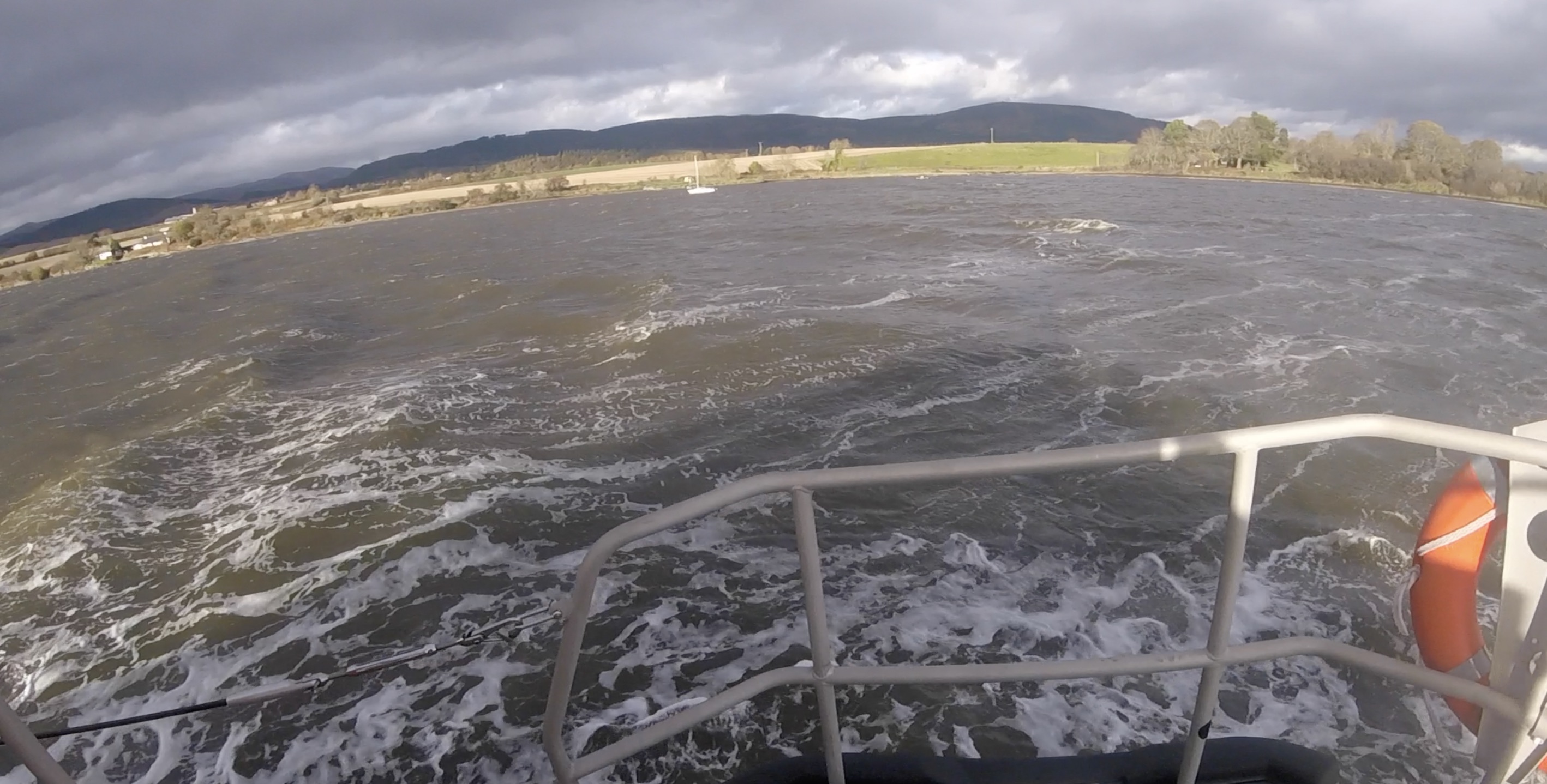 17ft Yacht underway to mooring with Lifeboat escorting