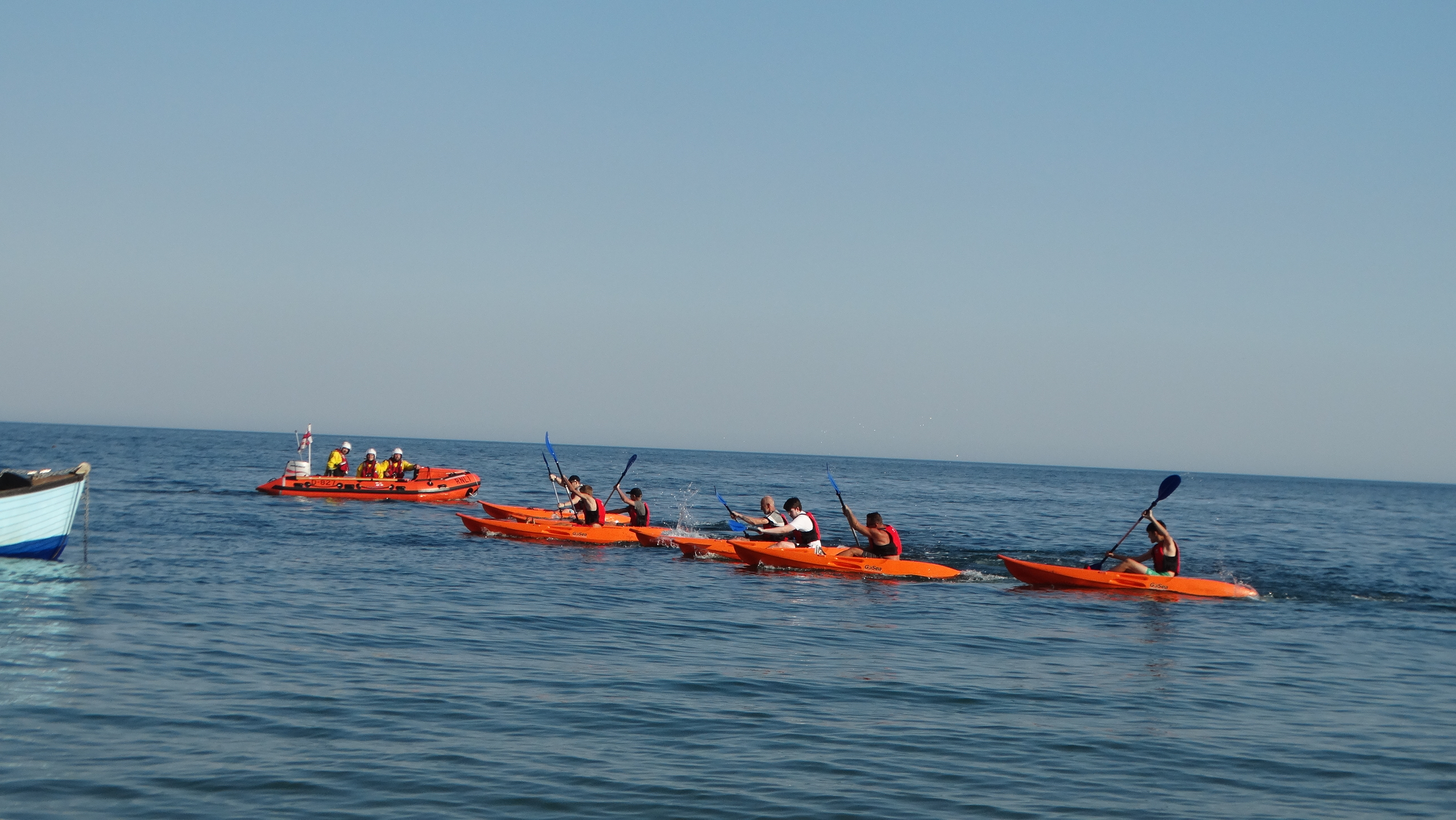 Canoe race starting with ILB in background