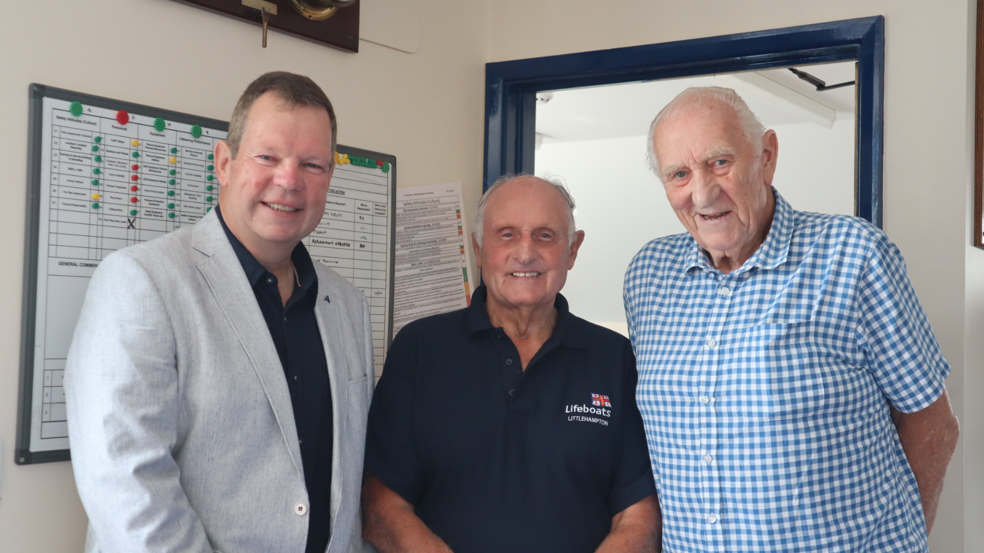 Geoff (centre) reunited with Mike McCartain and David Woollen to receive his 50 year medal