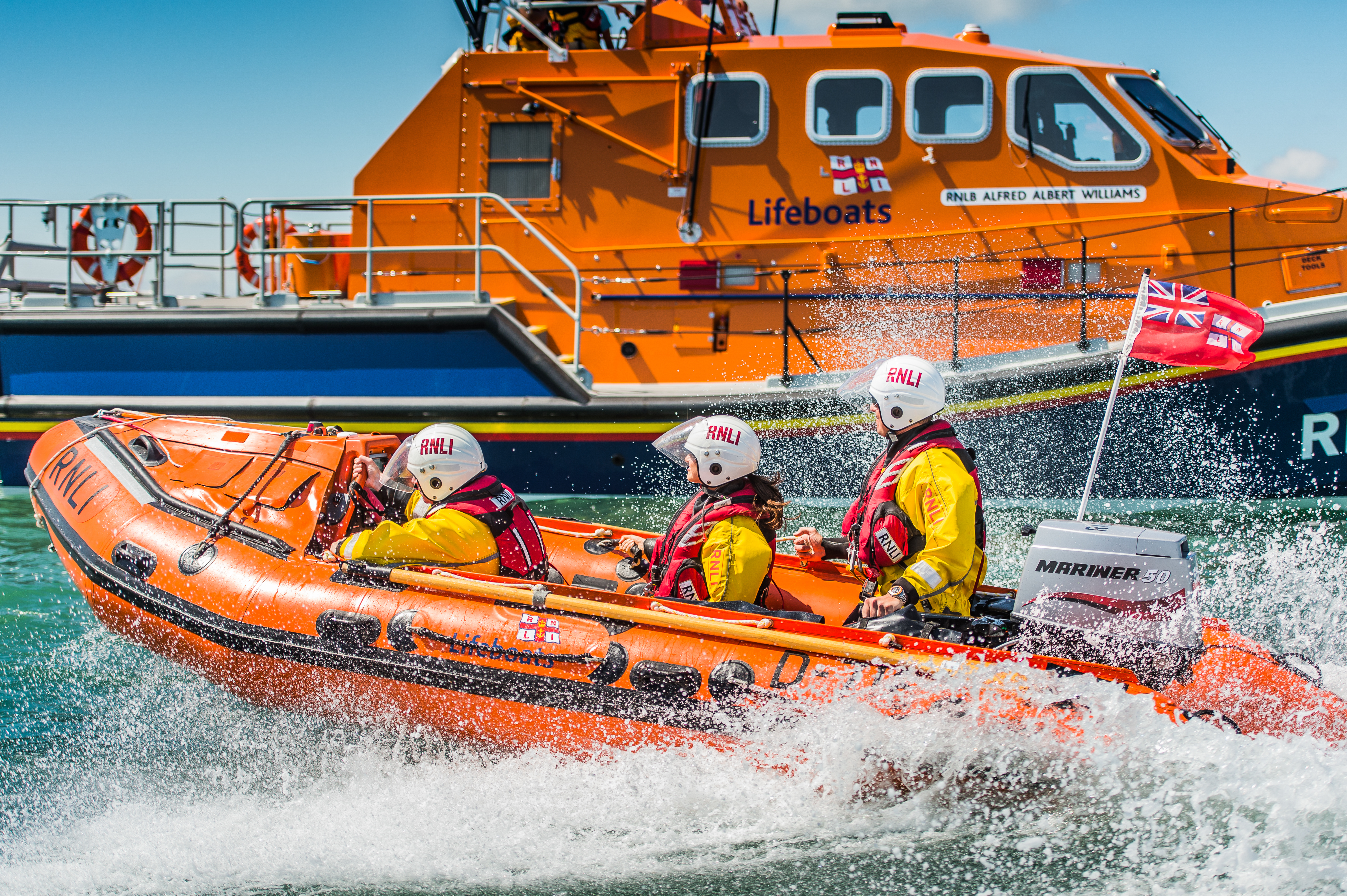 Portsmouth D-class inshore lifeboat Brian's Pride D-716 providing safety cover during the Americas Cup sailing race