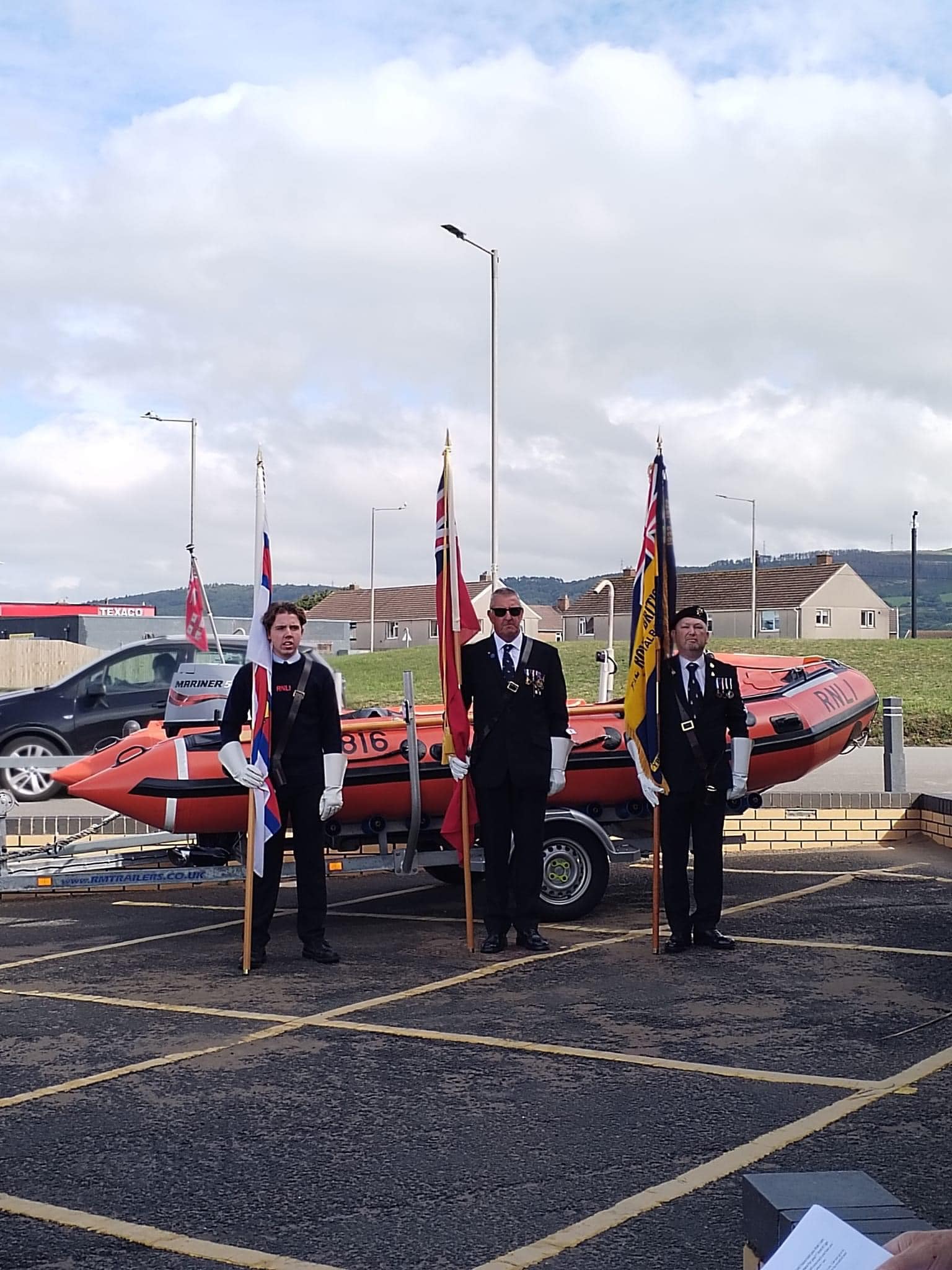 Flag bearers stand in honour