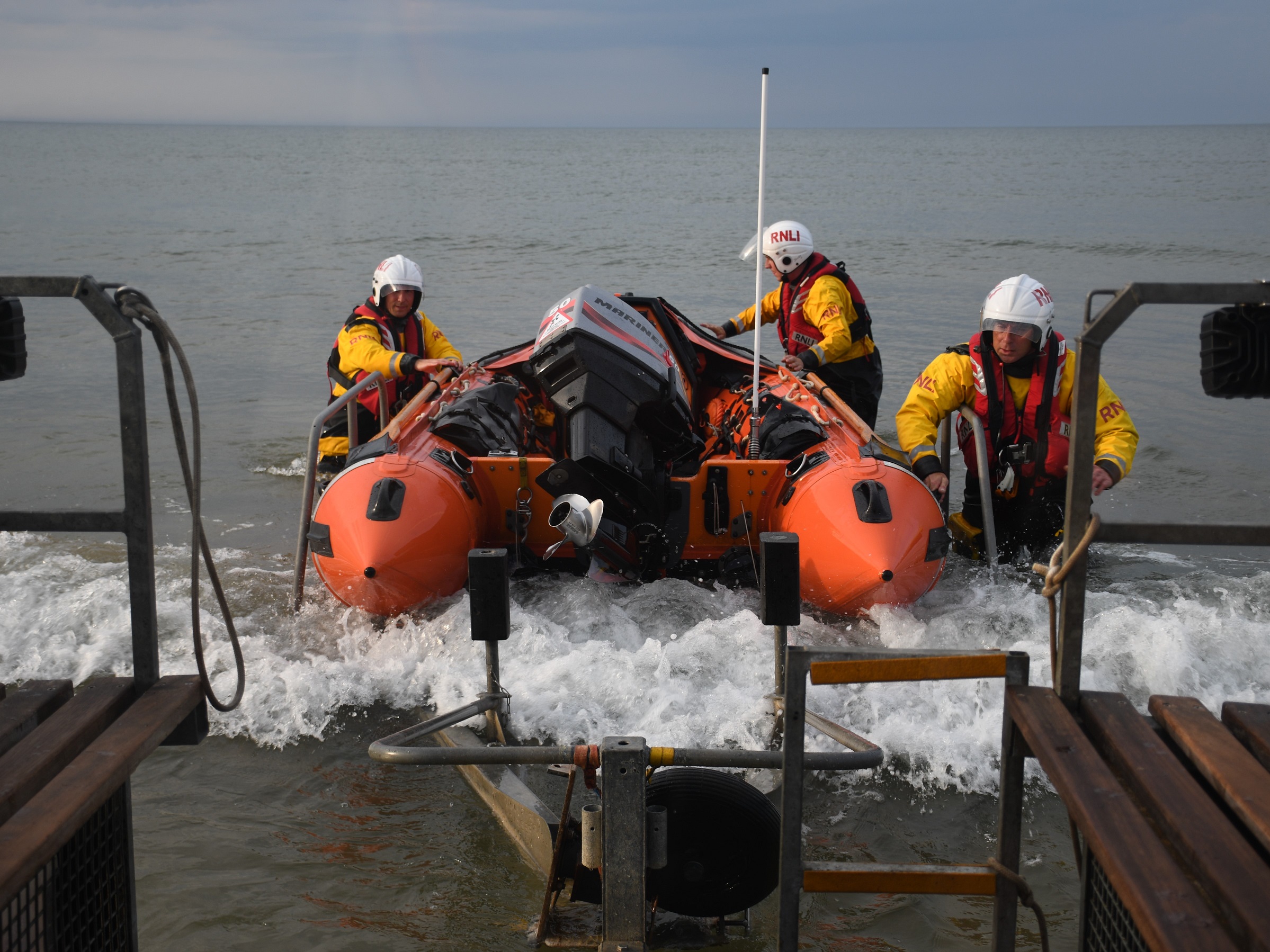 Wells inshore lifeboat being recovered at the low water recovery site to return to the boathouse