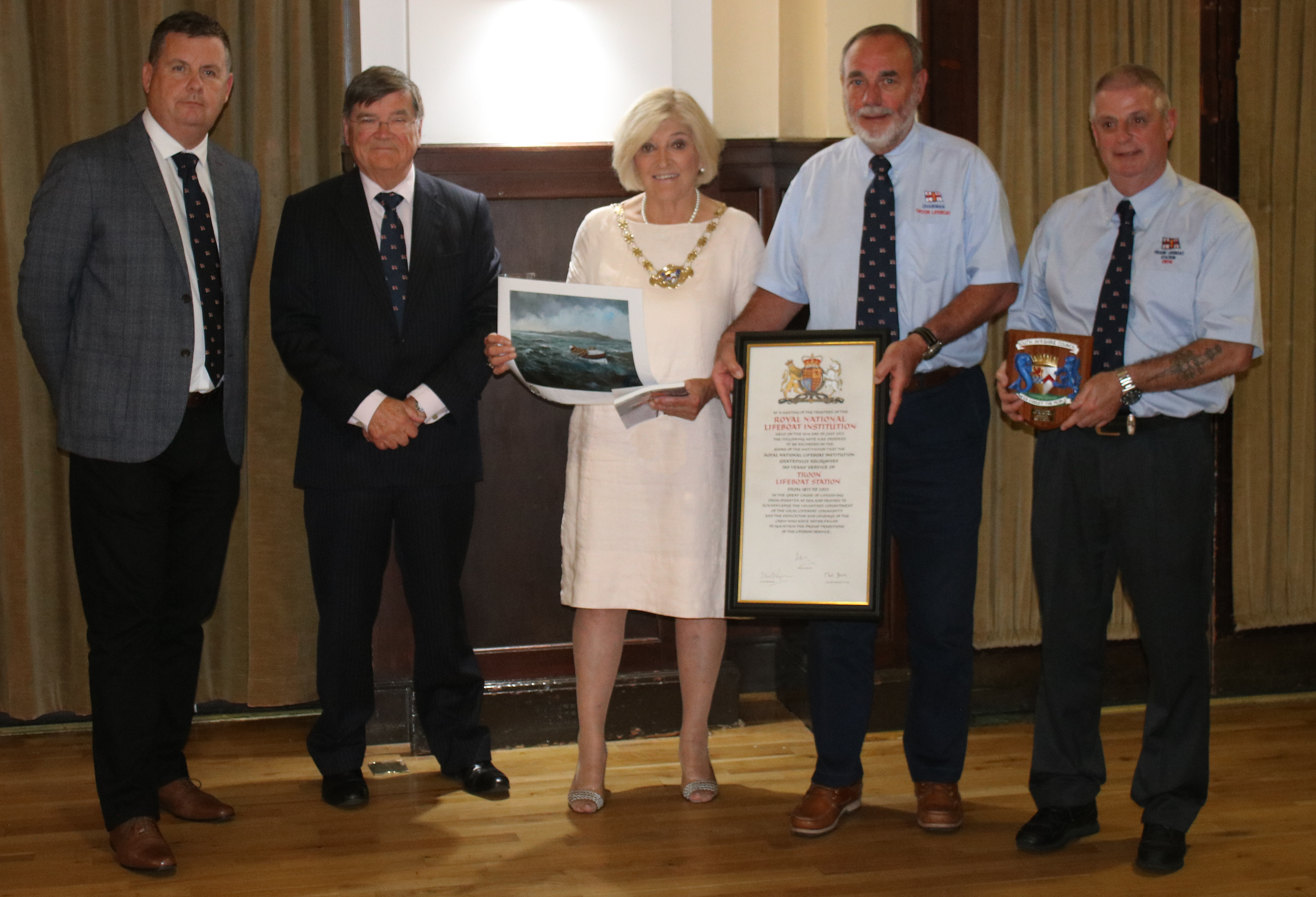 Pictured at the civic reception along with vellum certificate are Robert McMaster (Area Lifesaving Manager), Roger Lockwood (RNLI Trustee), Deputy Provost Mary Kilpatrick, John Steel (Chairman Troon Lifeboat Management Group) and Joe Millar (Troon lifeboat Coxswain).