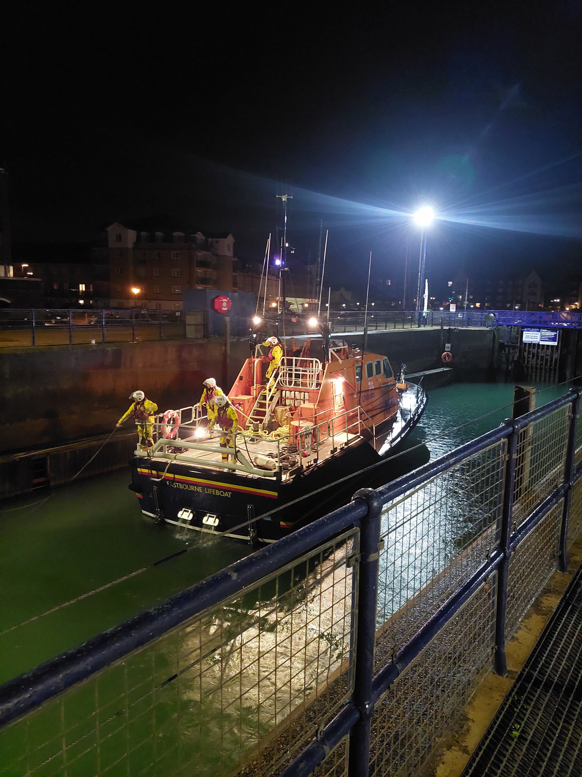 Crew at back of boat in the locks