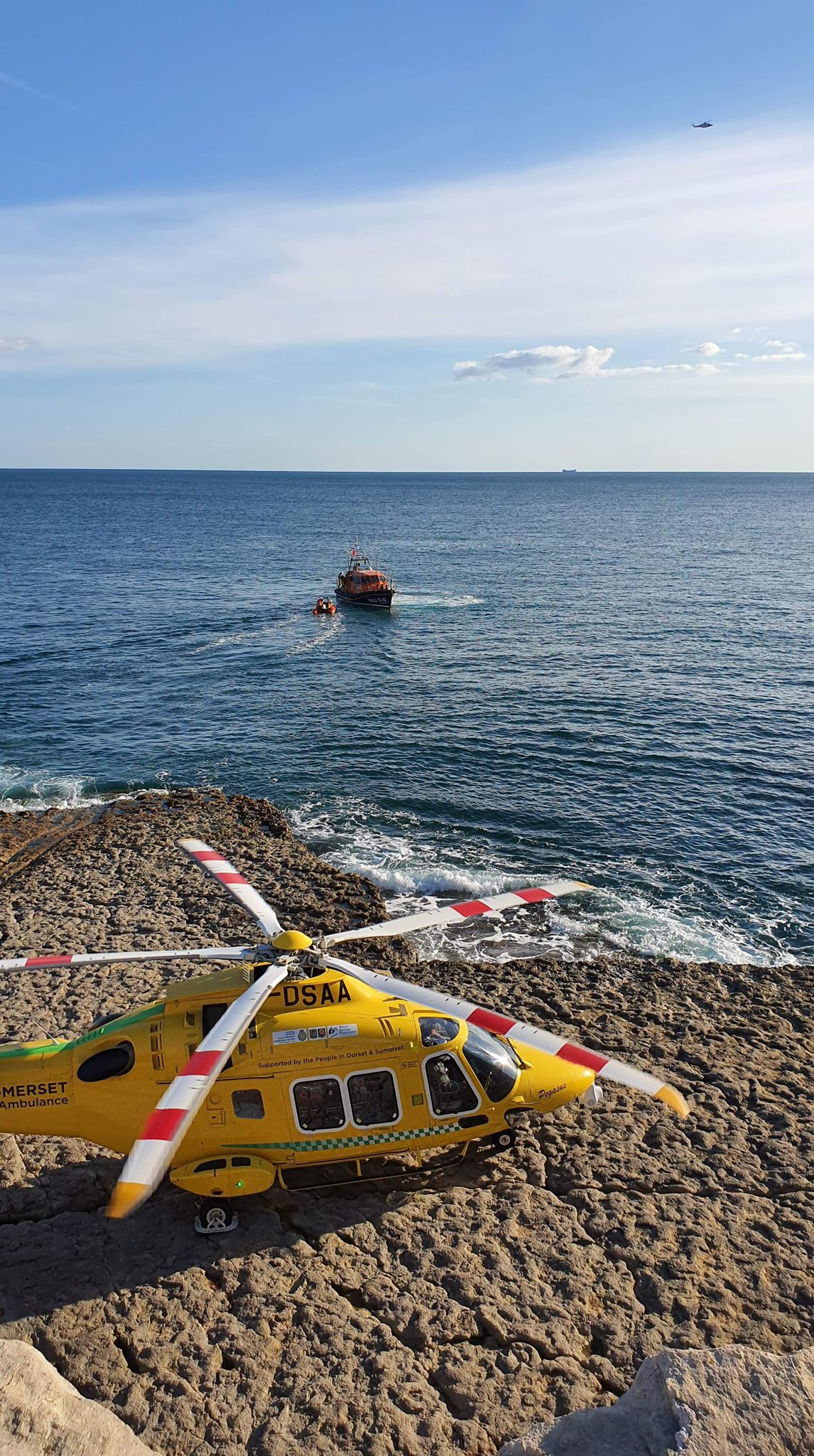 Dorset and Somerset Air Ambulance landed at Dancing Ledge with Swanage lifeboats on scene