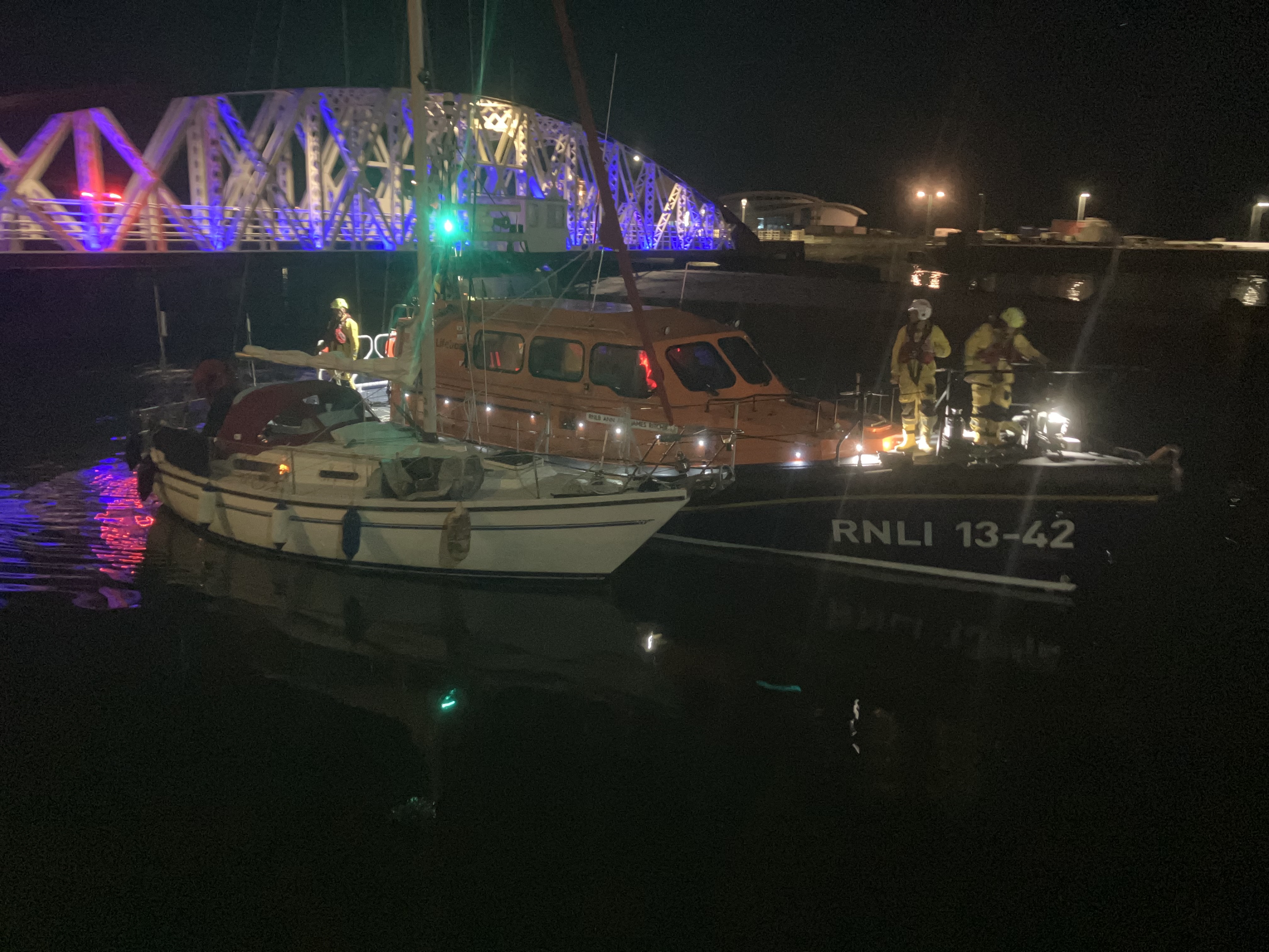 Ramsey Lifeboat Escorting Yacht into Ramsey Harbour
