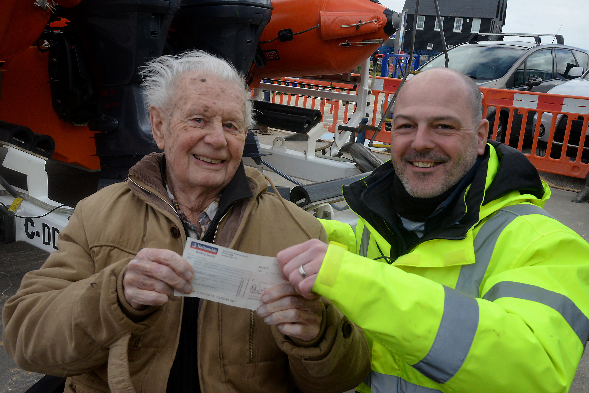 Philip Smith, 92, presents the cheque for £928 on behalf of the Wednesday Trio's Bowling League to Pete Fenton at Whitstable RNLI on Sunday.