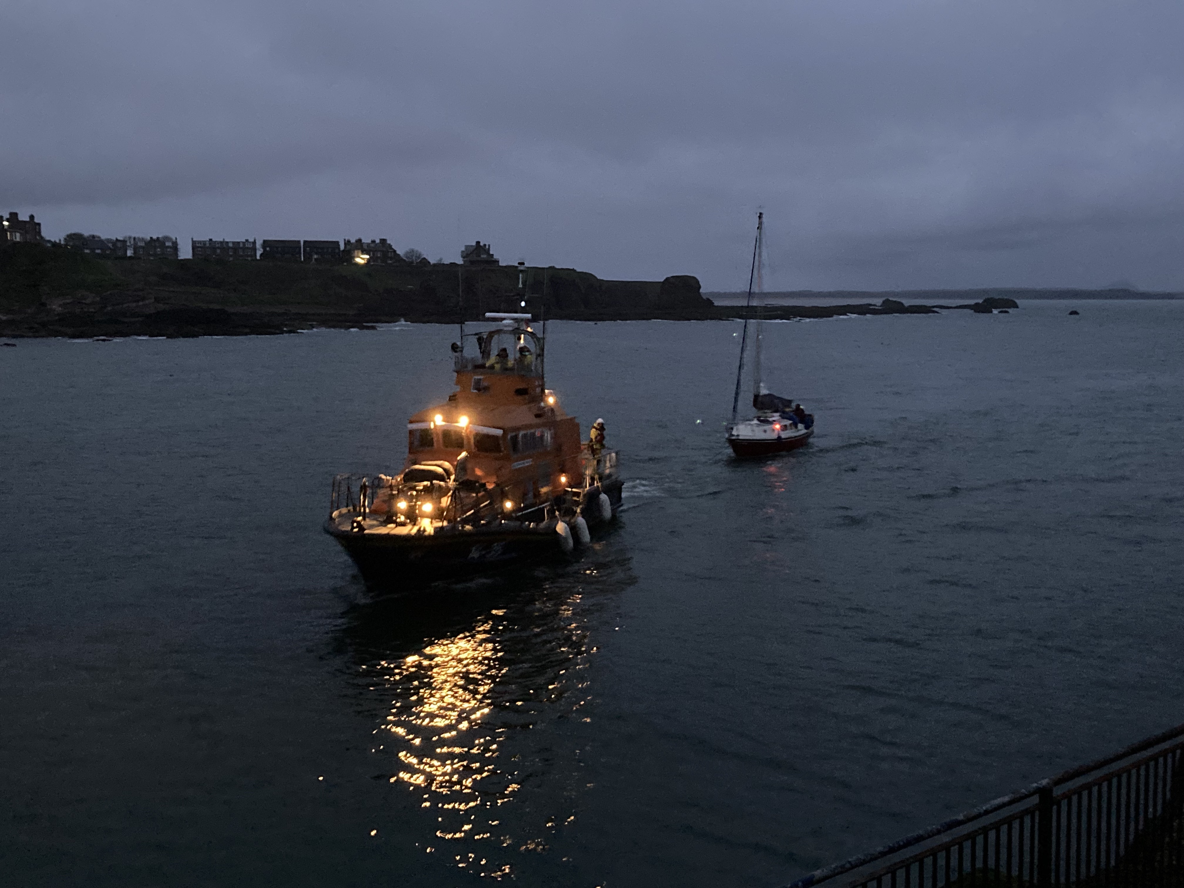 Photo shows Dunbar's all-weather Trent lifeboat towing a 23ft yacht into Dunbar Harbour at 5am.