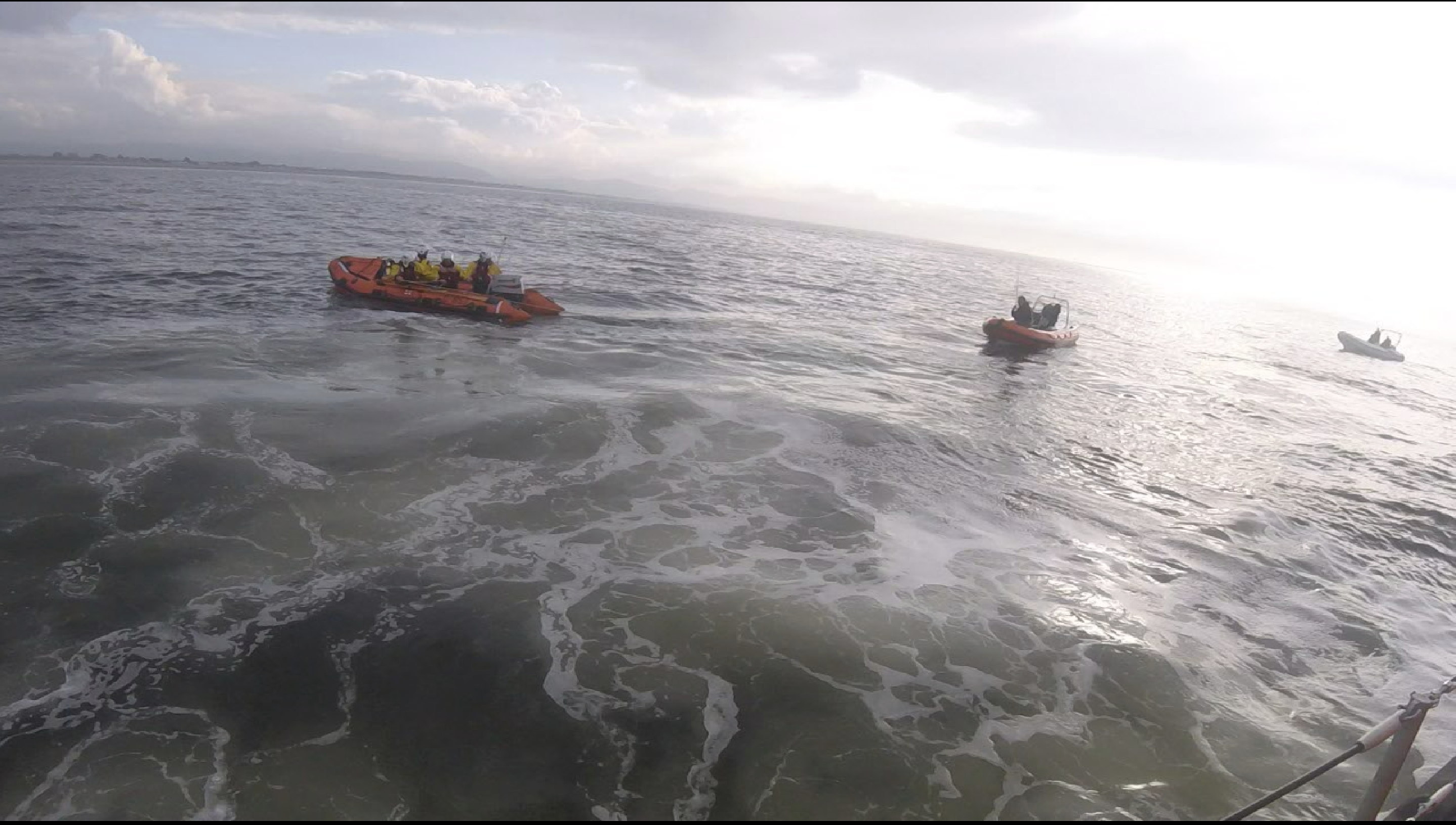 Rhyl inshore lifeboat taking casualty into Rhyl harbour.