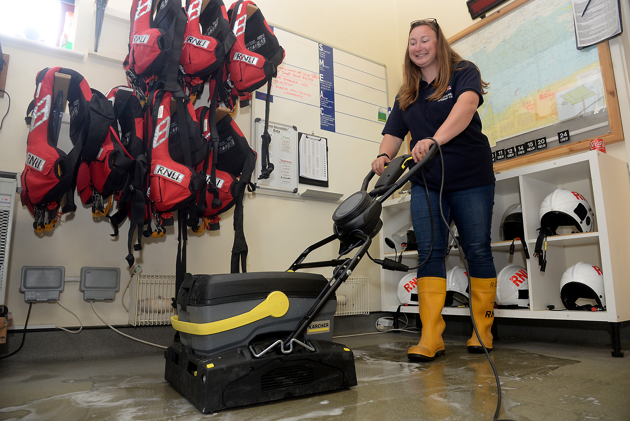 Helm Ruth Oliver swaps driving the lifeboat for the Karcher walk-behind Scrubber Dryer floor cleaner. Picture:RNLI Whitstable.