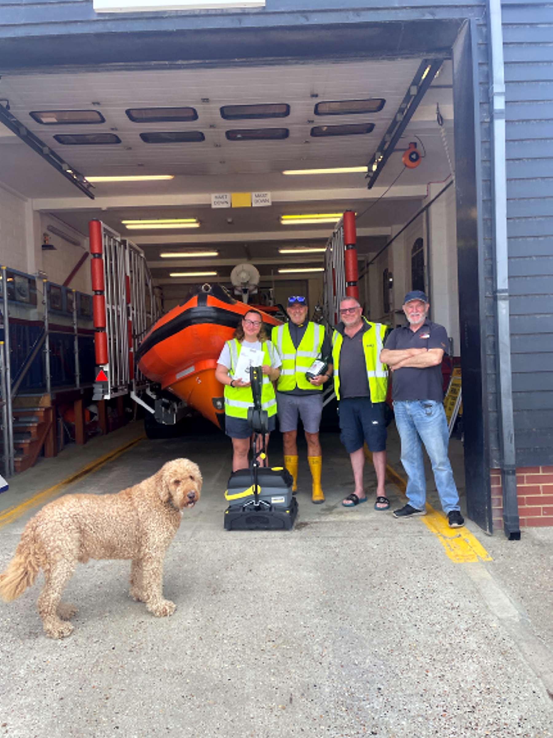 Norbert inspects the new Karcher floor cleaner and crew!