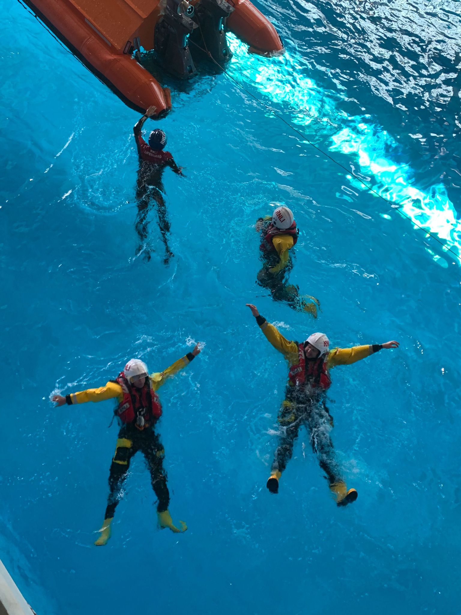 Crew members in the wave tank at the Sea Survival Centre