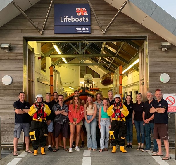 Photo of RNLI lifeguards with crew at Mudeford Lifeboat Station