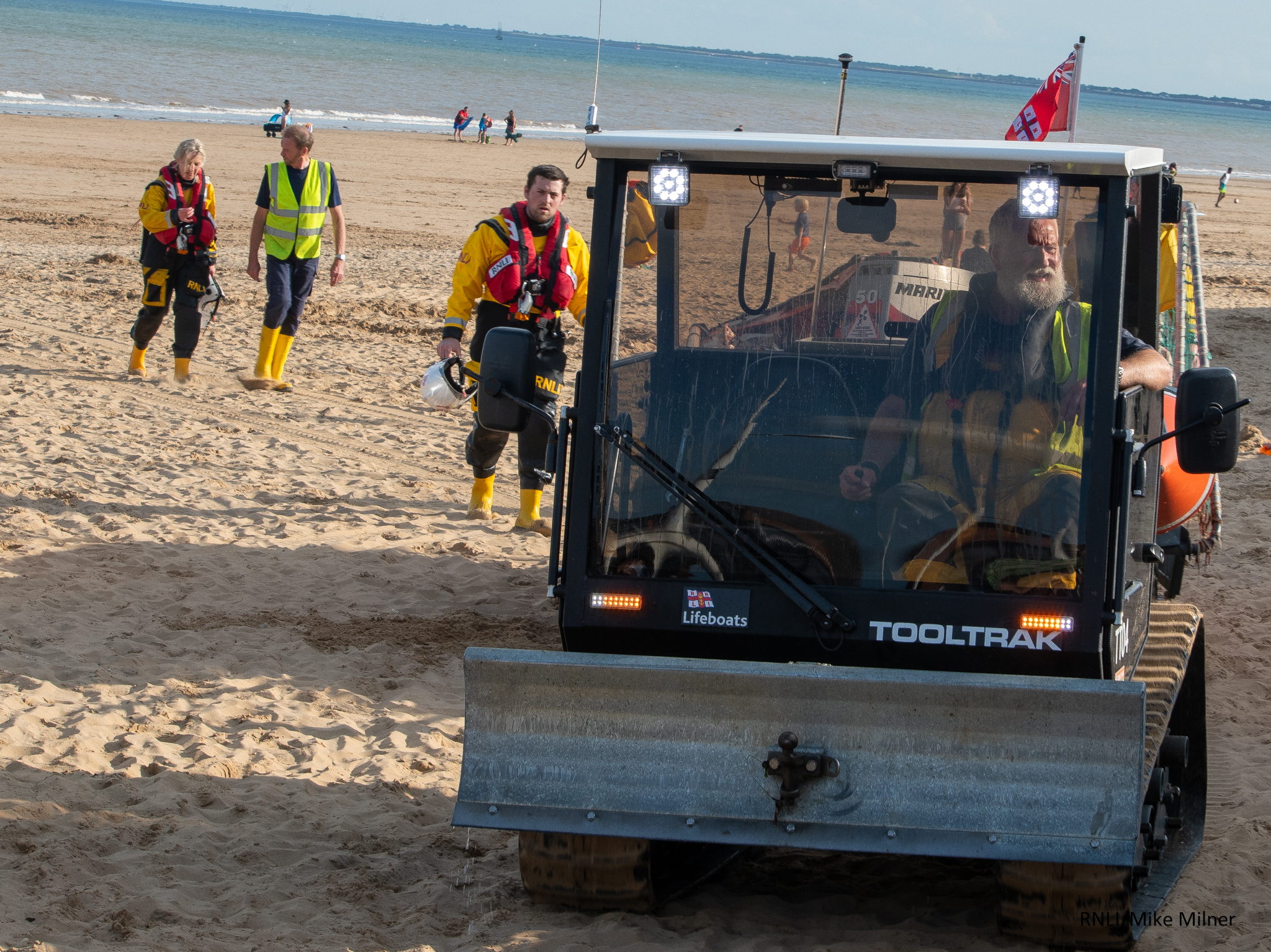 Volunteer crew of Bridlington RNLI returning after paddleboard launch.