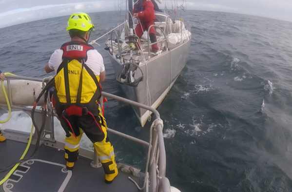 Crew member David Casey securing a towline 