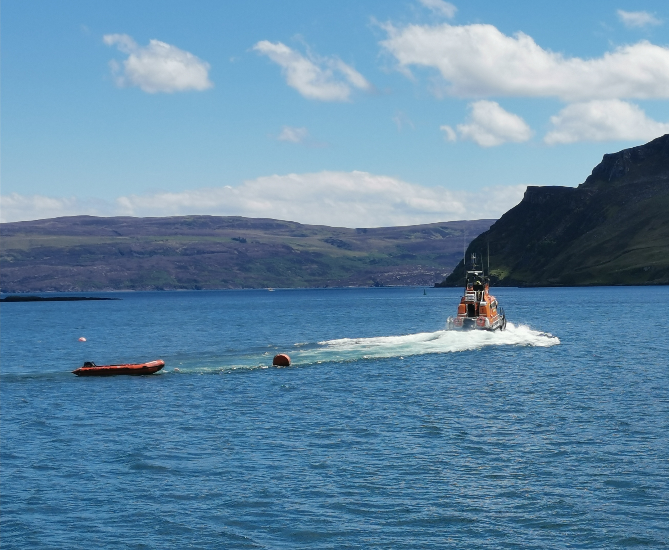 A stock photo of Portree Lifeboat launching from its mooring.