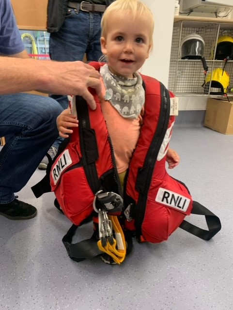 Casper in RNLI lifejacket at Wells RNLI station